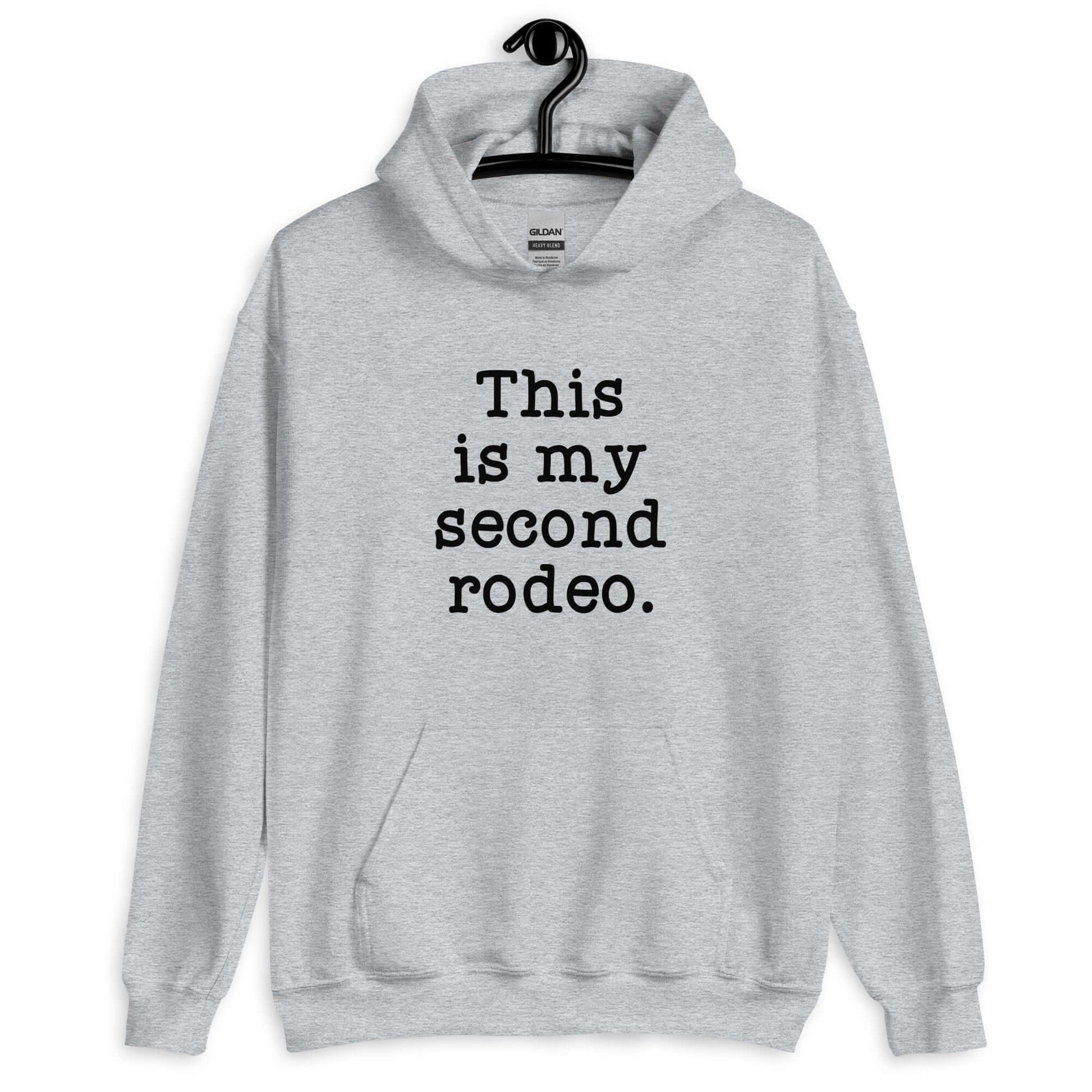 Light sport grey hoodie sweatshirt with the funny phrase This is my second rodeo printed on the front.