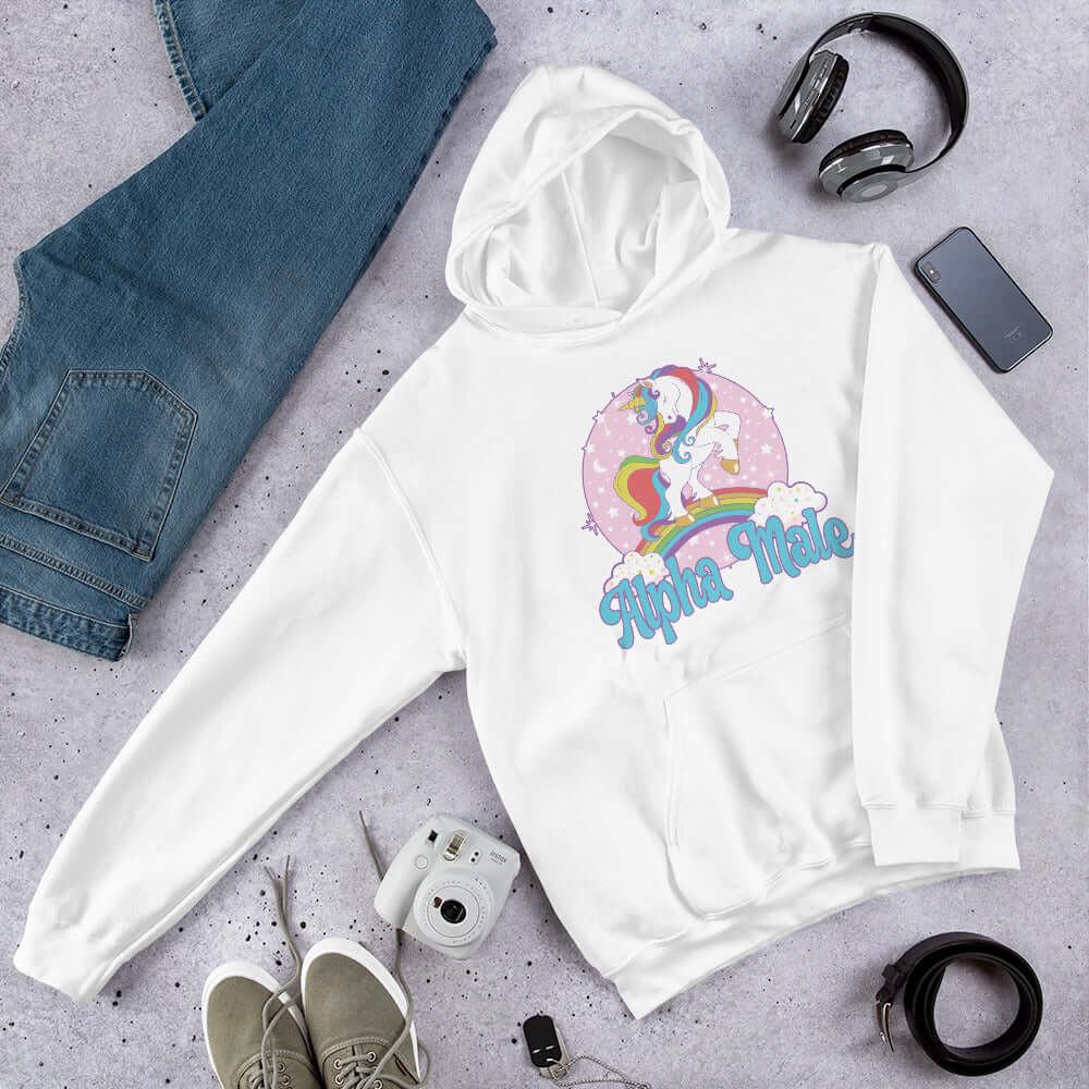 White hoodie sweatshirt with funny pastel rainbow unicorn graphics and the words Alpha Male printed on the front.