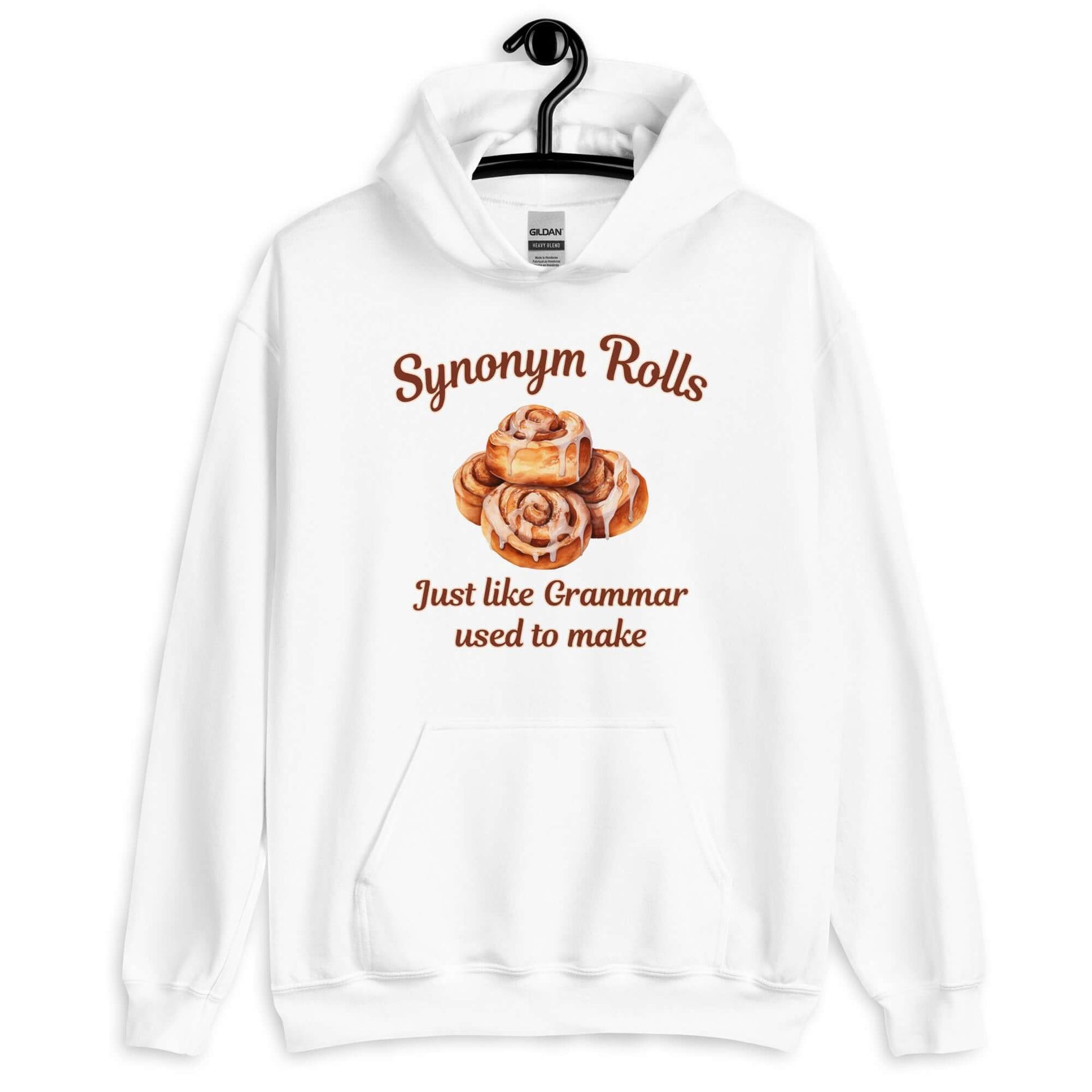 White hoodie sweatshirt with an image of cinnamon rolls and the pun phrase Synonym rolls Just like Grammar used to make printed on the front.