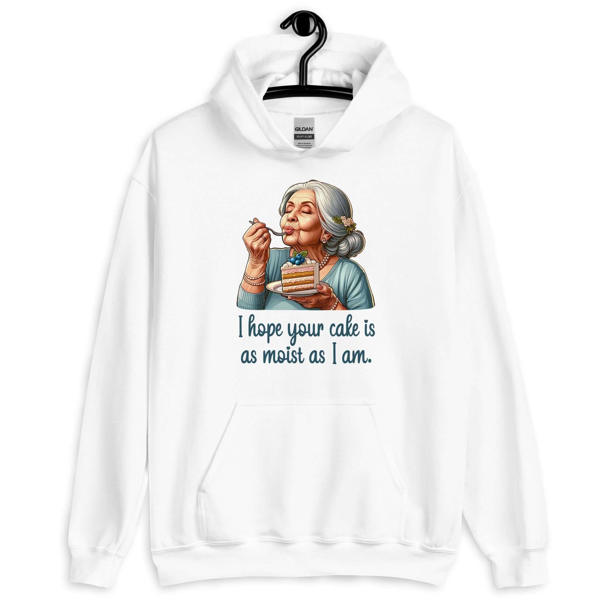 White hoodie with image of grey haired older woman enjoying a bite of a piece of cake with the words I hope your cake is as moist as I am printed on the front.