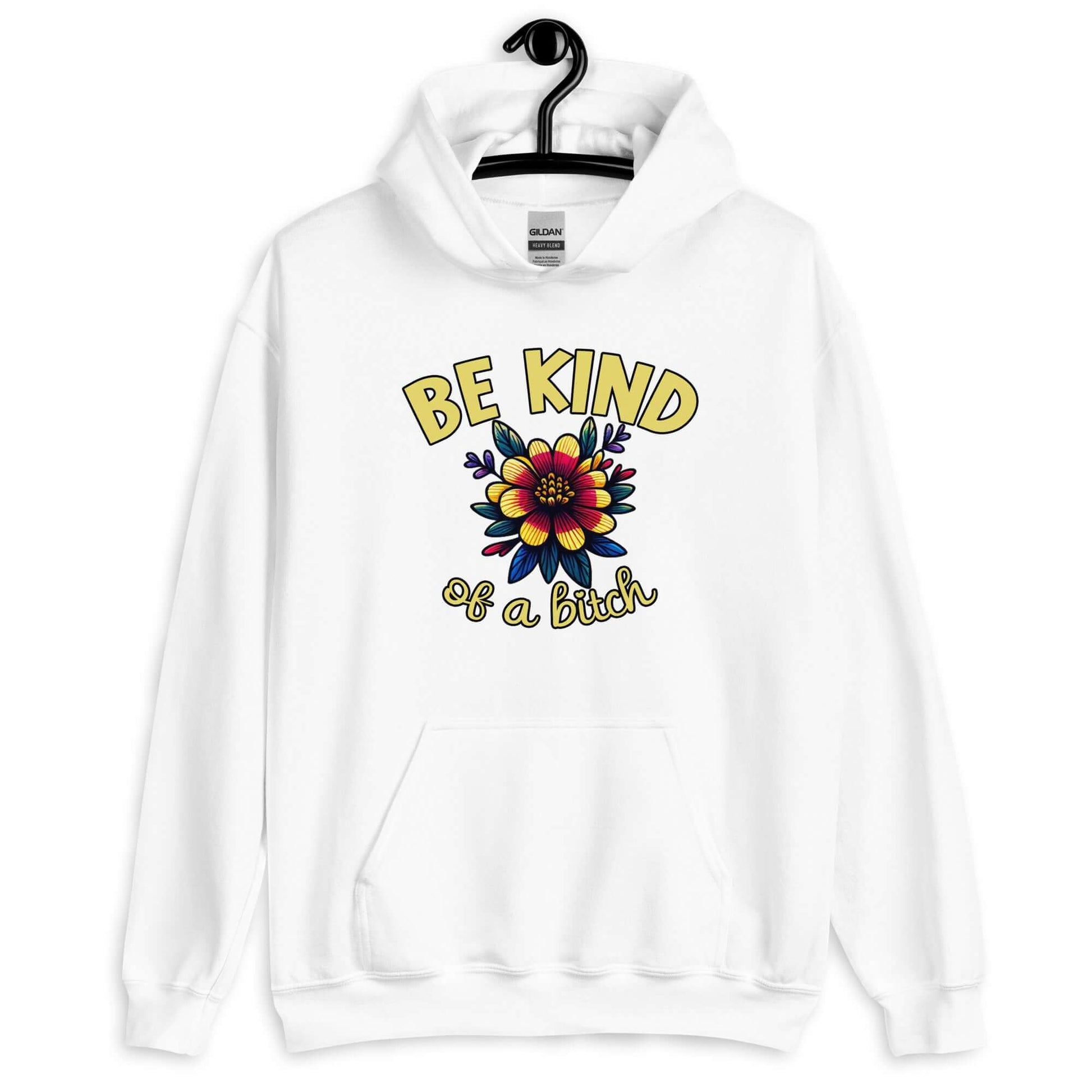 White hoodie sweatshirt with an image of a flower and the words Be kind above the flower in yellow bold block font. The words Of a bitch are smaller in script font under the flower. The design is printed on the front of the hoodie.