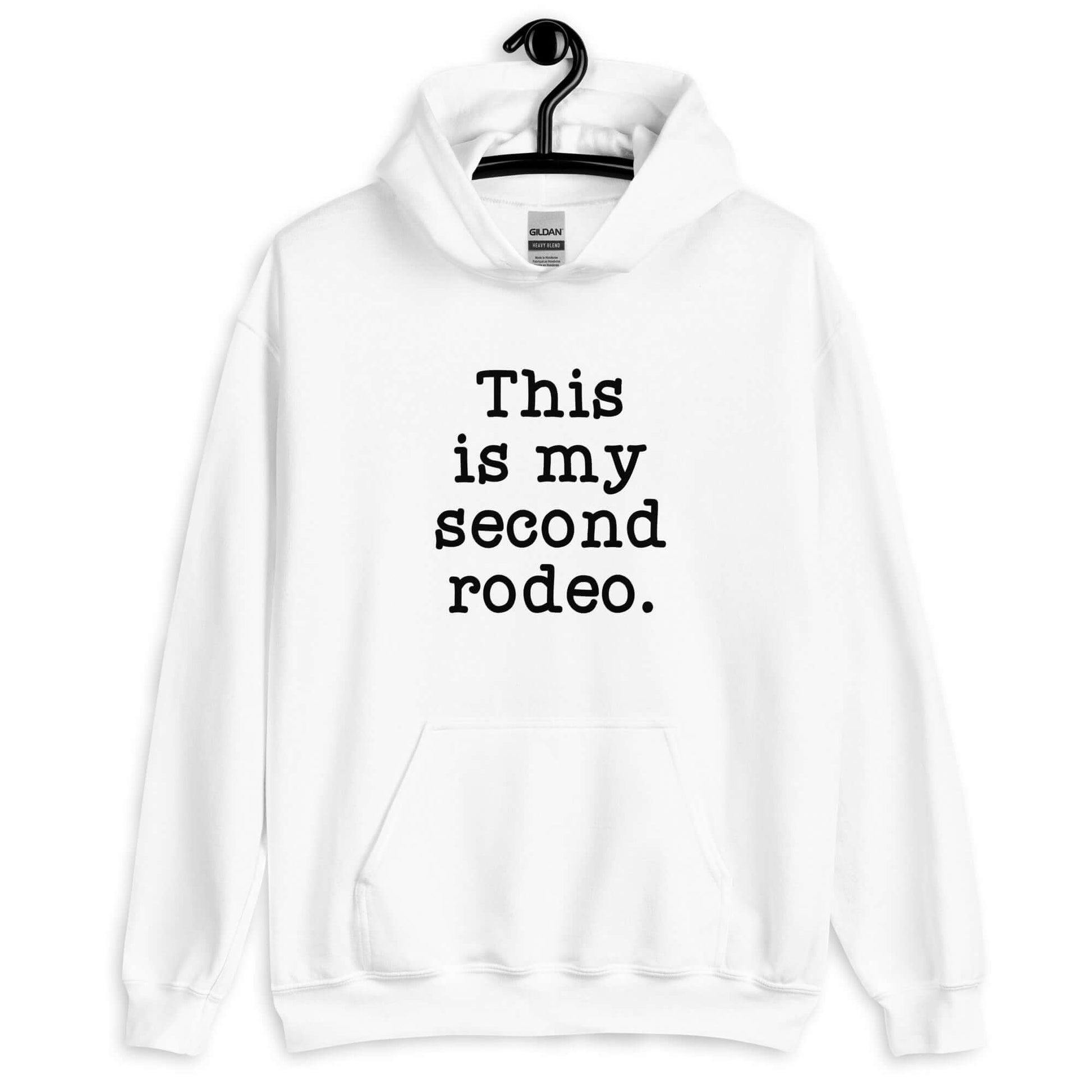 White hoodie sweatshirt with the funny phrase This is my second rodeo printed on the front.