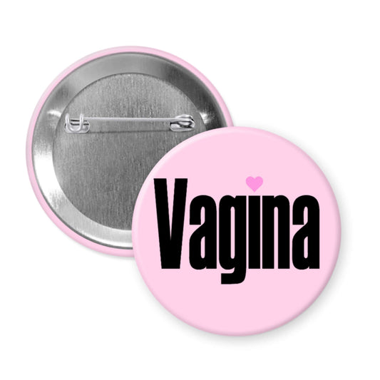 Pink pinback button with the single word vagina printed on it.