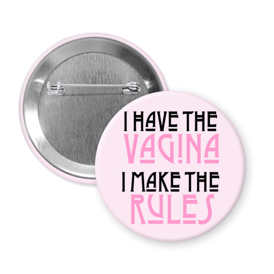 Pink pinback button that says I have the vagina , I make the rules. 