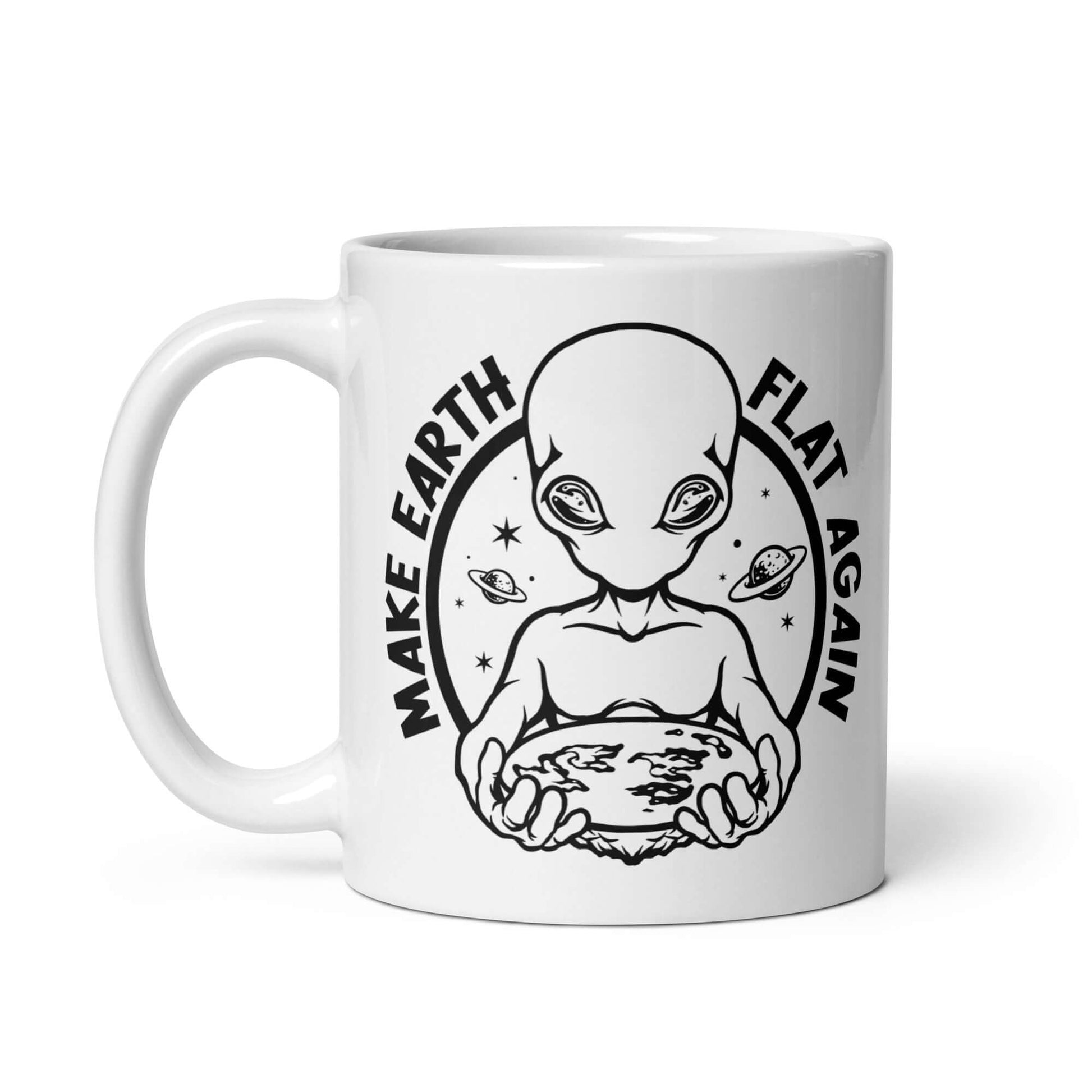 White ceramic coffee mug with an image of an alien holding flat earth and the phrase Make earth flat again printed on both sides.