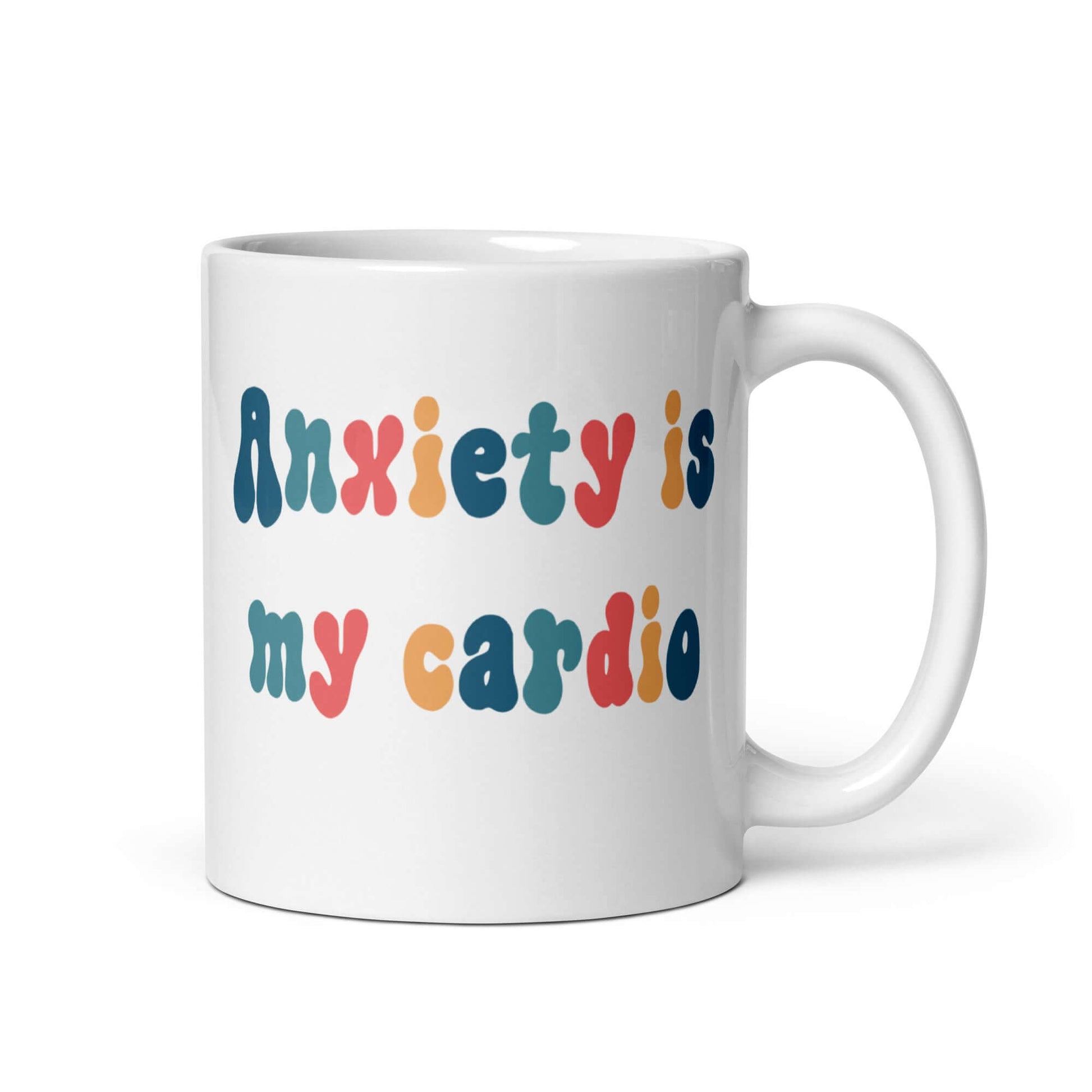 White ceramic mug with the phrase Anxiety is my cardio printed in multiple colors on both sides of the mug.