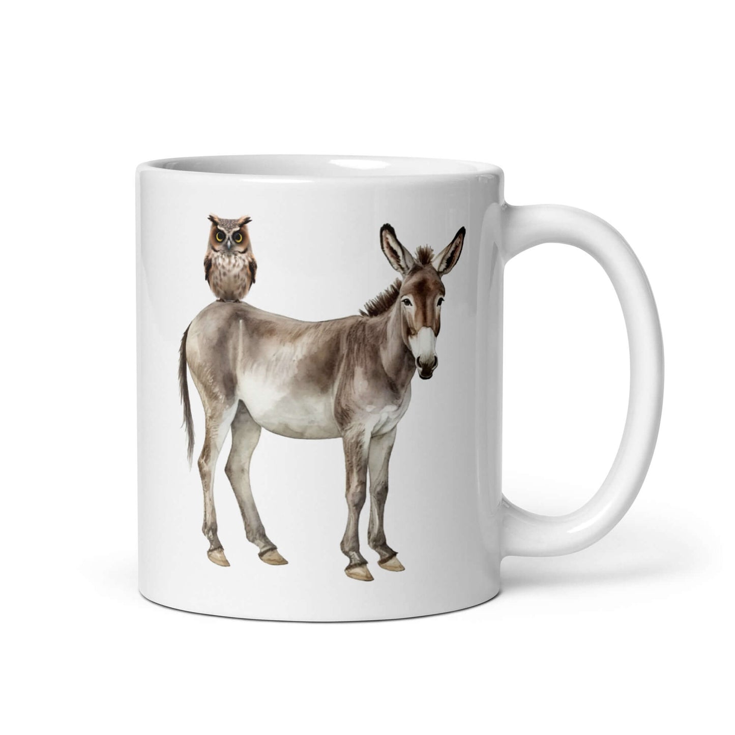 White ceramic coffee mug with an image of a donkey with wise owl sitting on it printed on both sides of the mug.