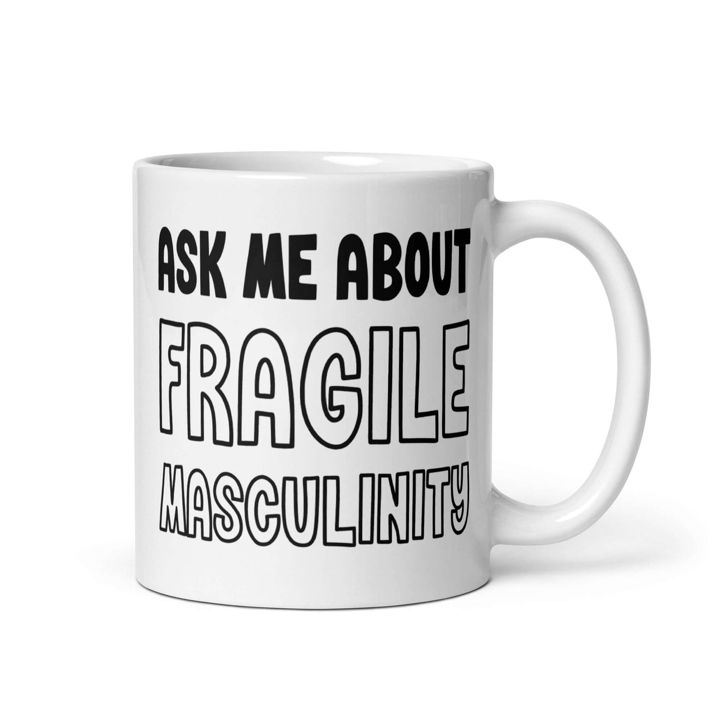 White ceramic mug with the phrase Ask me about fragile masculinity printed on both sides of the mug.