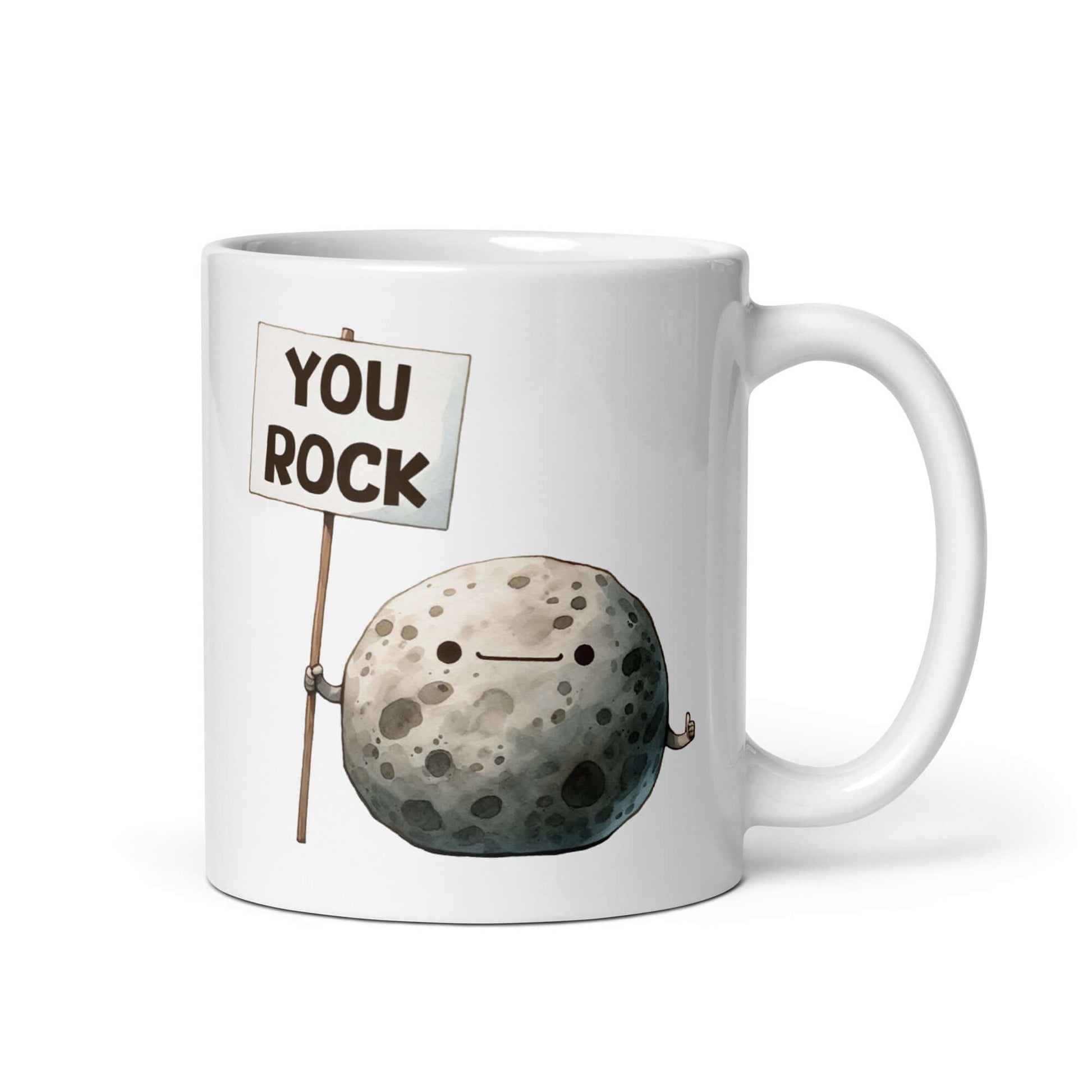 White ceramic mug that has an image of a grey rock that is holding a sign. The sign says You Rock. The image is printed on both sides of the mug.