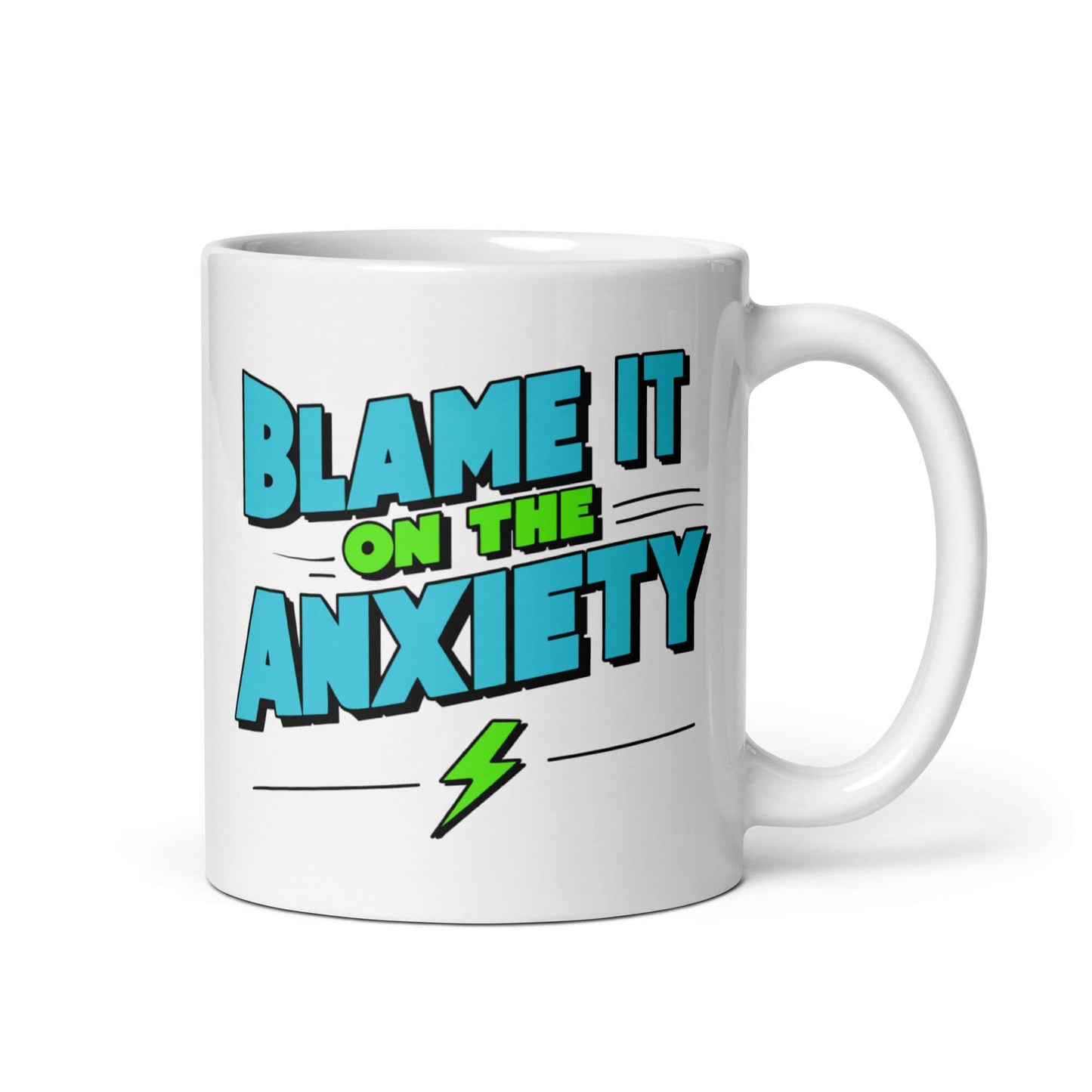 White ceramic mug with the phrase Blame is on the anxiety printed on both sides. The graphics are bold and in aqua and lime green.