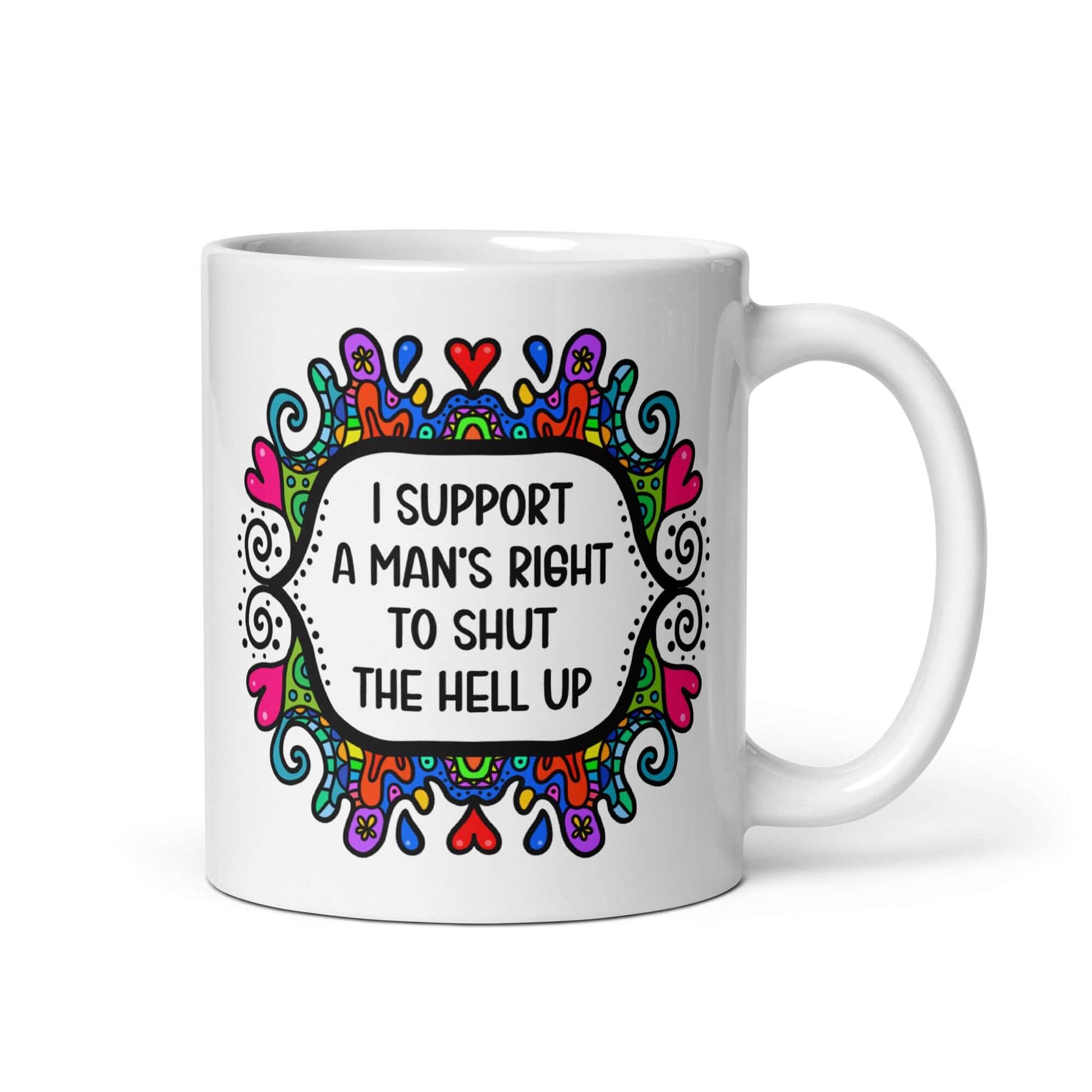 White ceramic mug with a colorful doodle graphic and the words I support a man's right to shut the hell up. The design is printed on both sides of the mug.