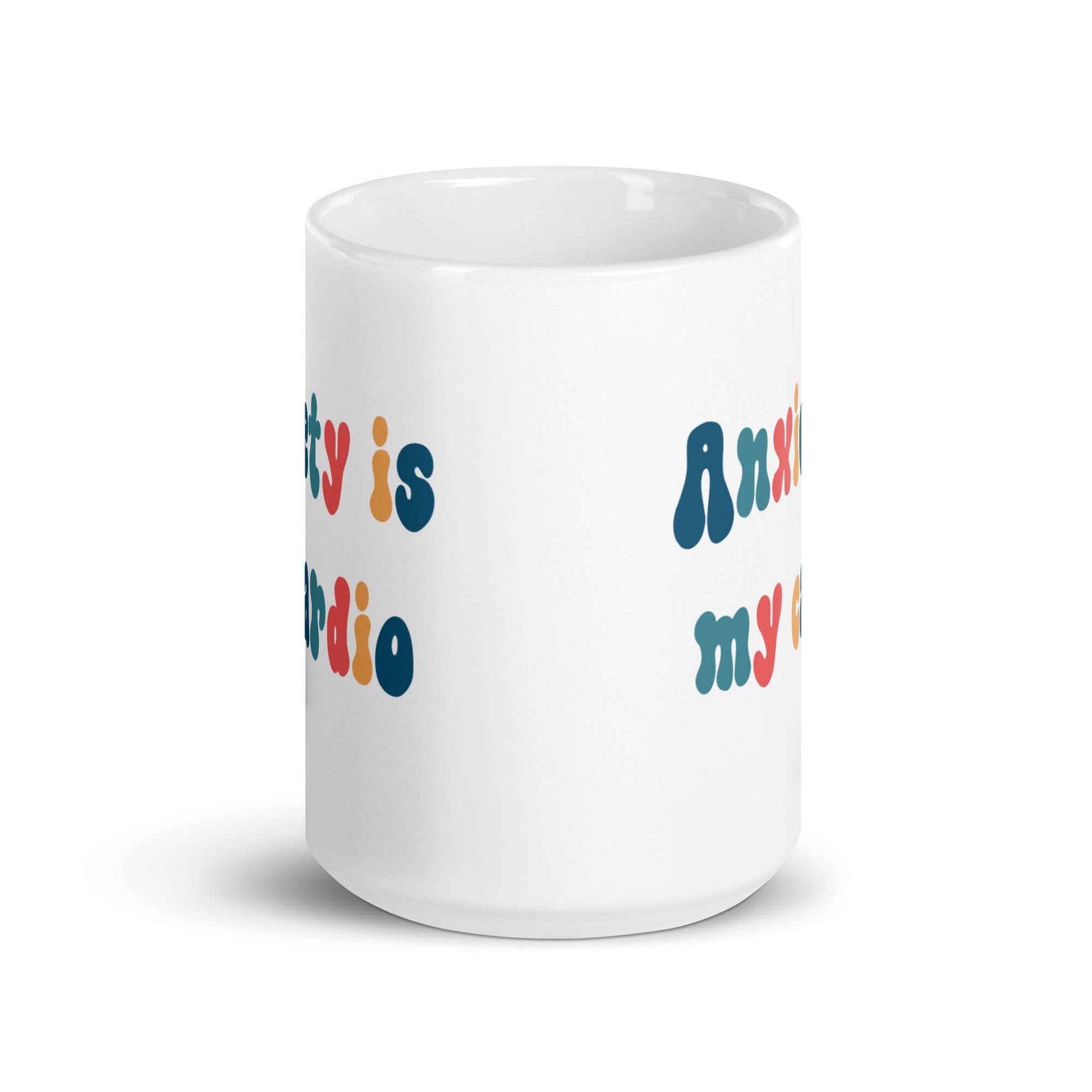 White ceramic mug with the phrase Anxiety is my cardio printed in multiple colors on both sides of the mug.