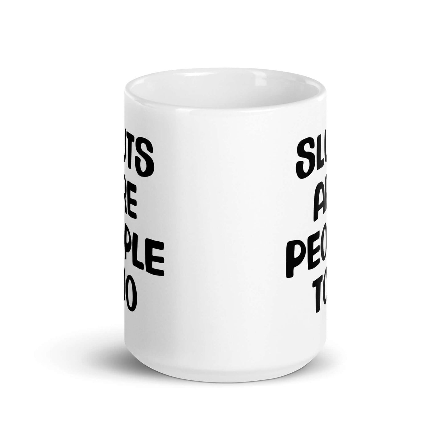 White ceramic mug with the phrase Sluts are people too printed on both sides.