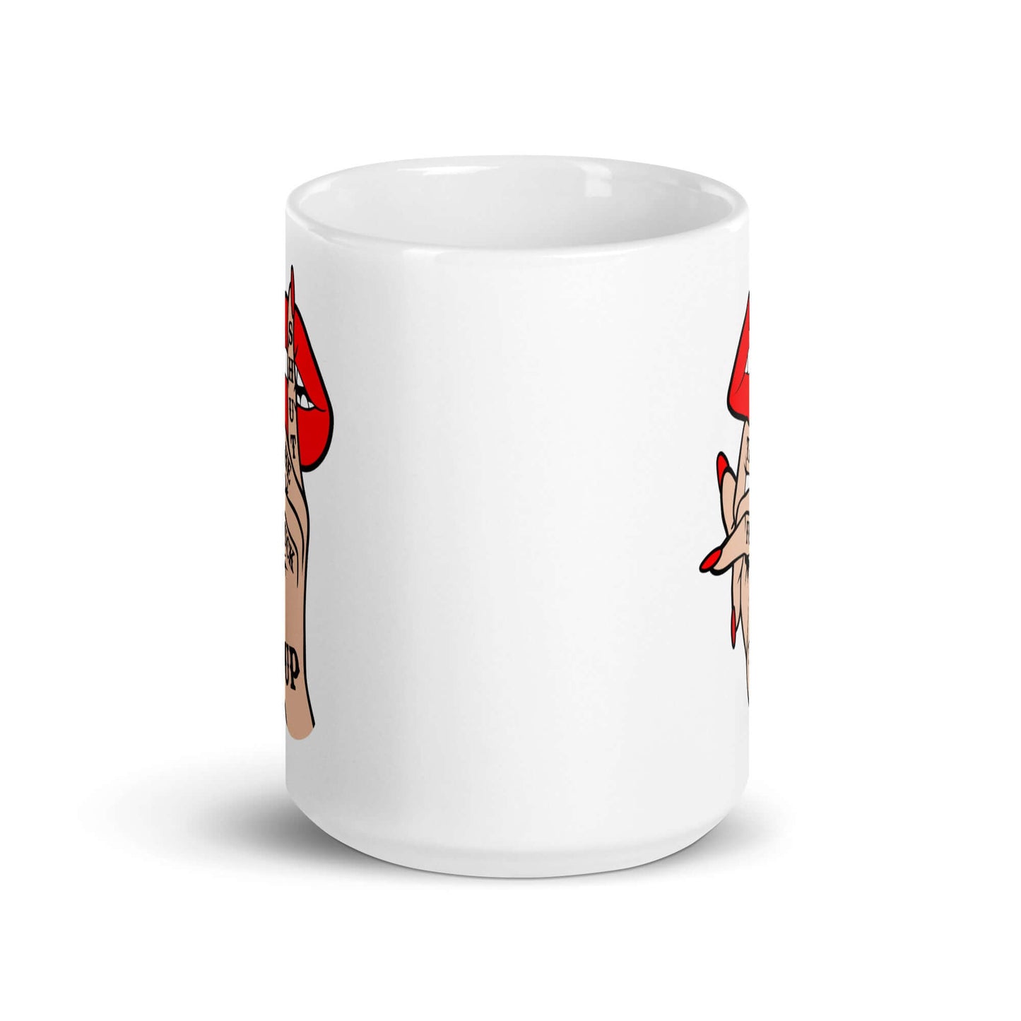 White ceramic mug with an image of a hand over lips making the shh gesture. The words Shut the fuck up are printed on the hand. The graphics are printed on both sides of the mug.