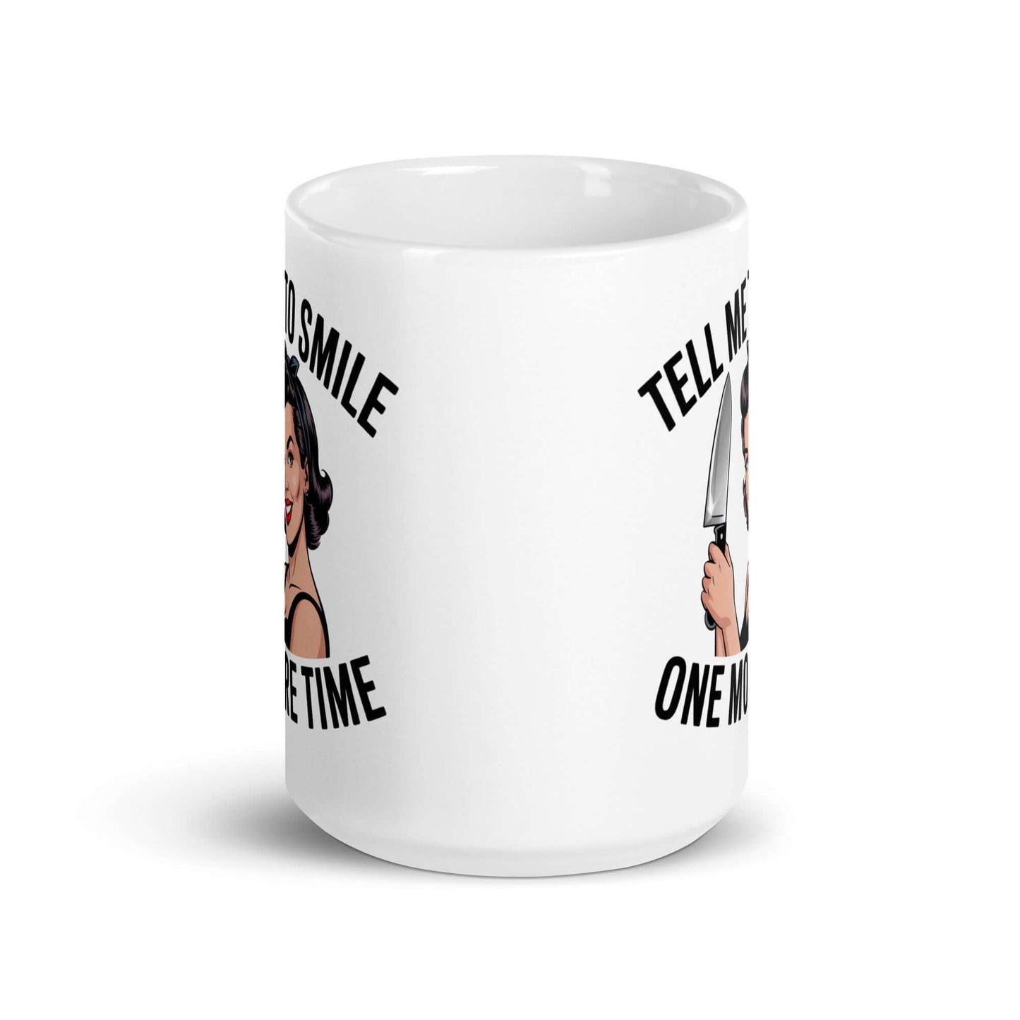 White ceramic mug with graphic of a woman holding a knife and the phrase 'Tell me to smile one more time'. 