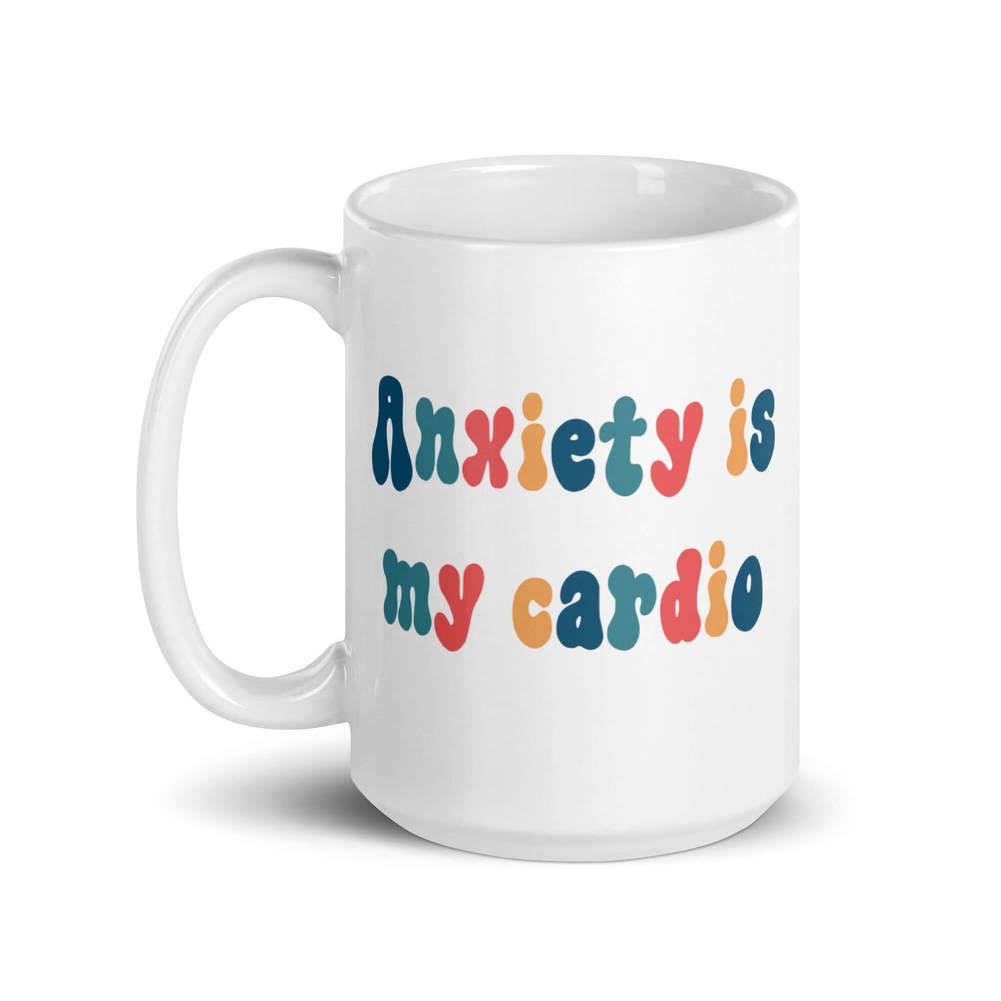 White ceramic mug with the phrase Anxiety is my cardio printed in multiple colors on both sides of the mug.