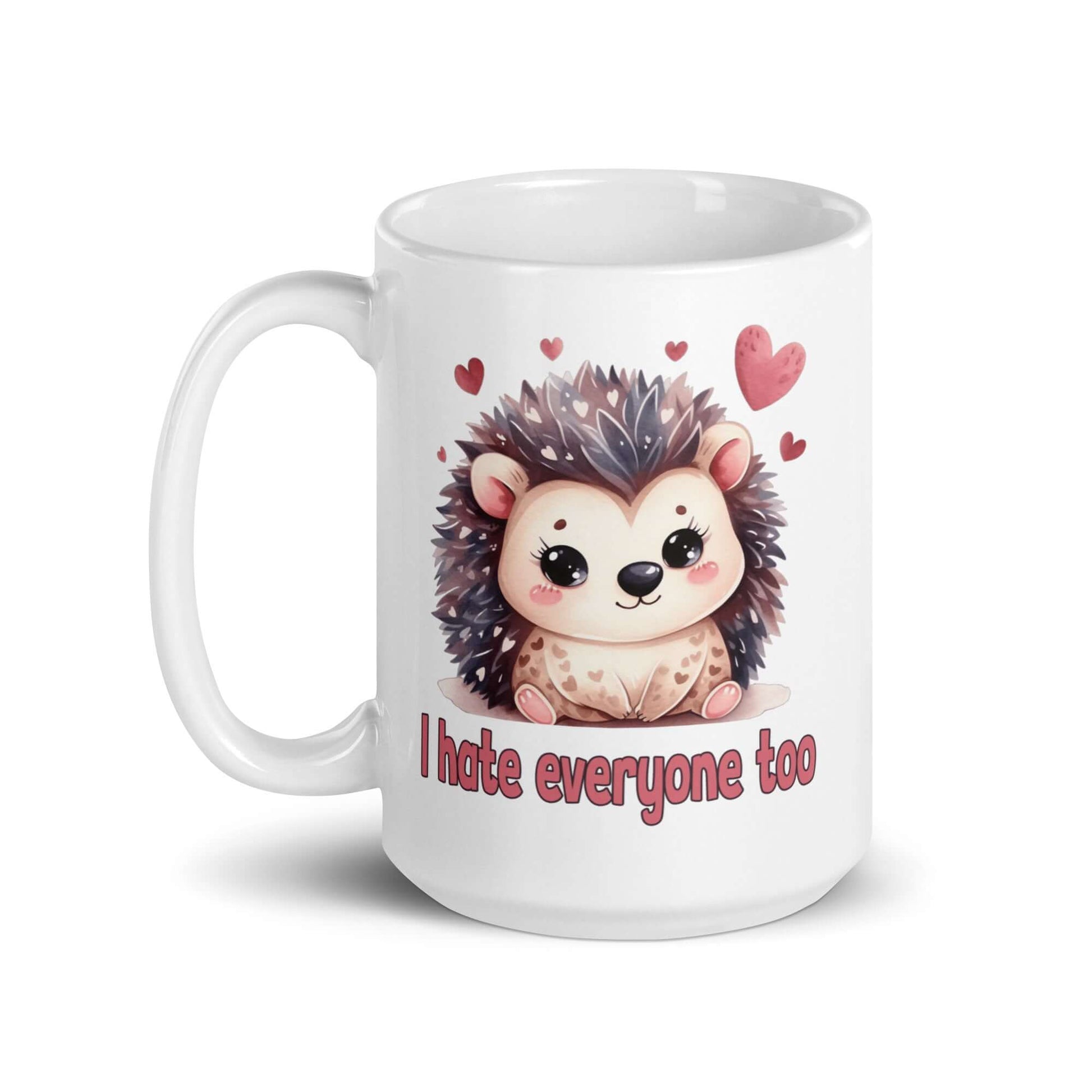 White ceramic mug with cute hedgehog graphic and the words I hate everyone too printed on both sides of the mug.
