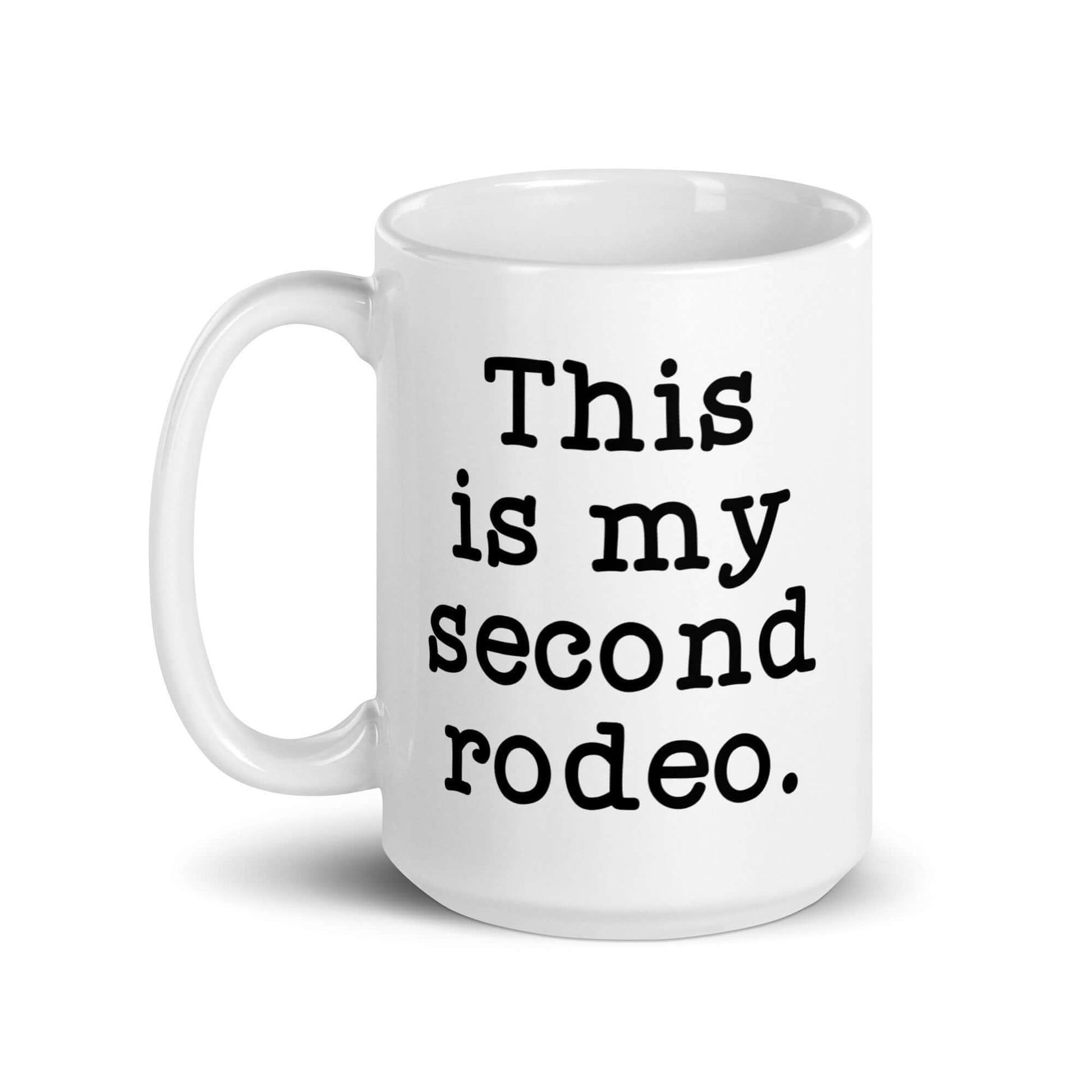 White ceramic mug with the funny phrase This is my second rodeo printed on both sides of the mug.