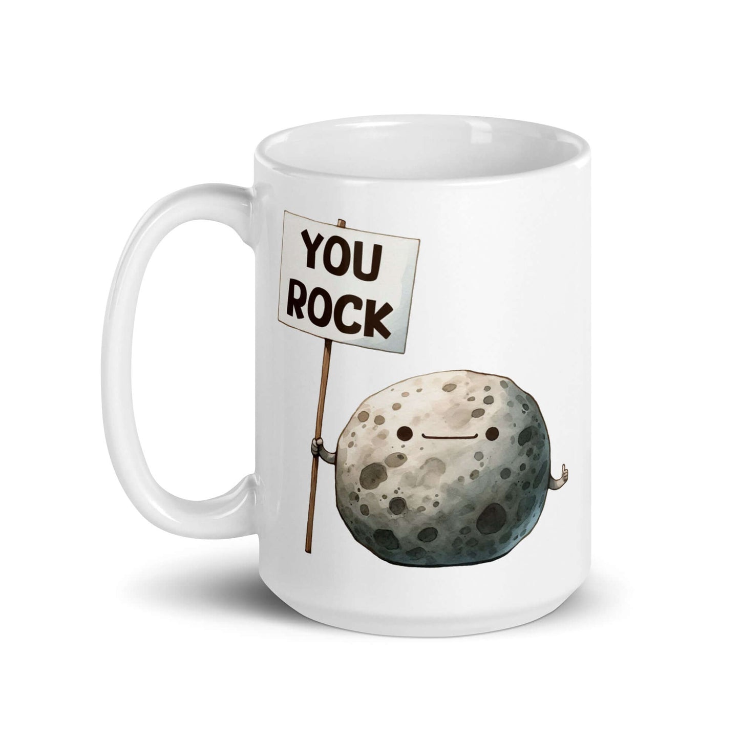 White ceramic mug that has an image of a grey rock that is holding a sign. The sign says You Rock. The image is printed on both sides of the mug.