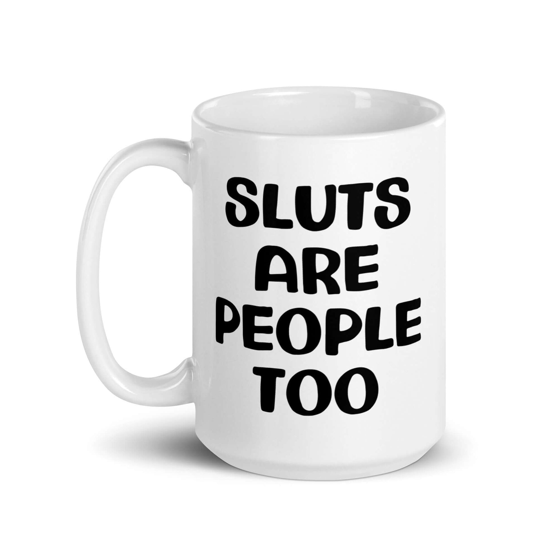 White ceramic mug with the phrase Sluts are people too printed on both sides.