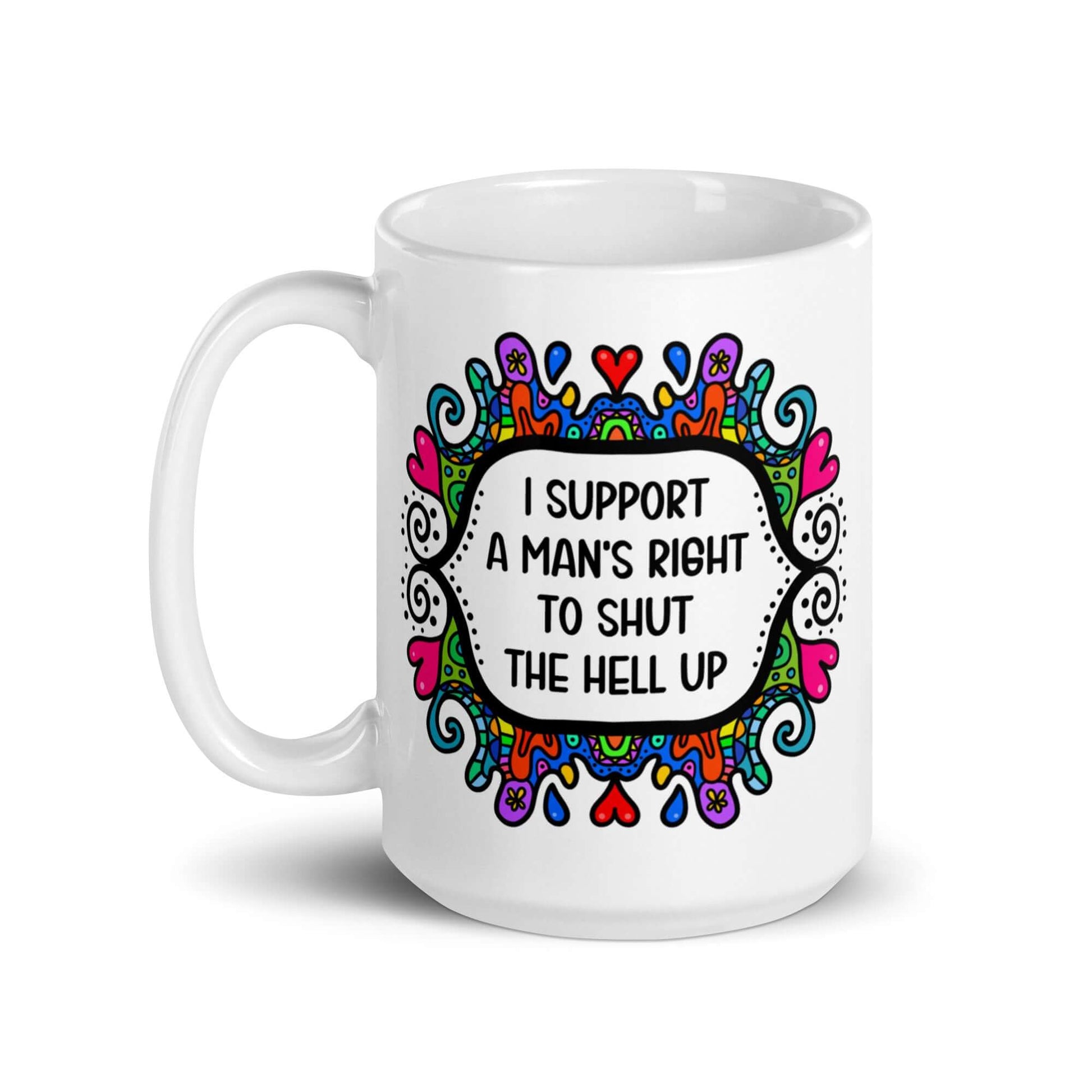 White ceramic mug with a colorful doodle graphic and the words I support a man's right to shut the hell up. The design is printed on both sides of the mug.