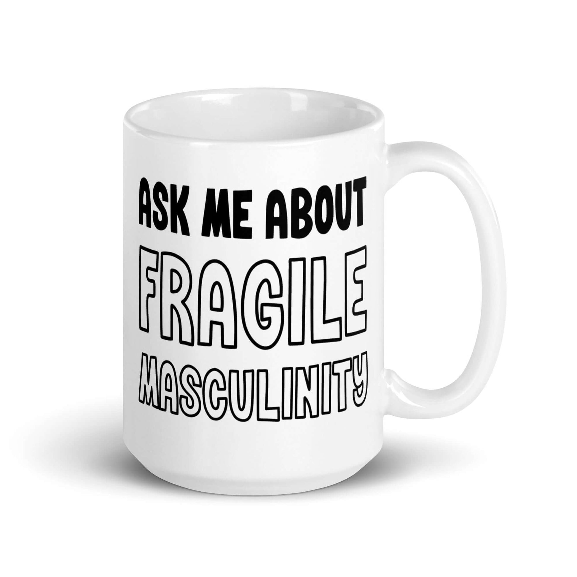 White ceramic mug with the phrase Ask me about fragile masculinity printed on both sides of the mug.