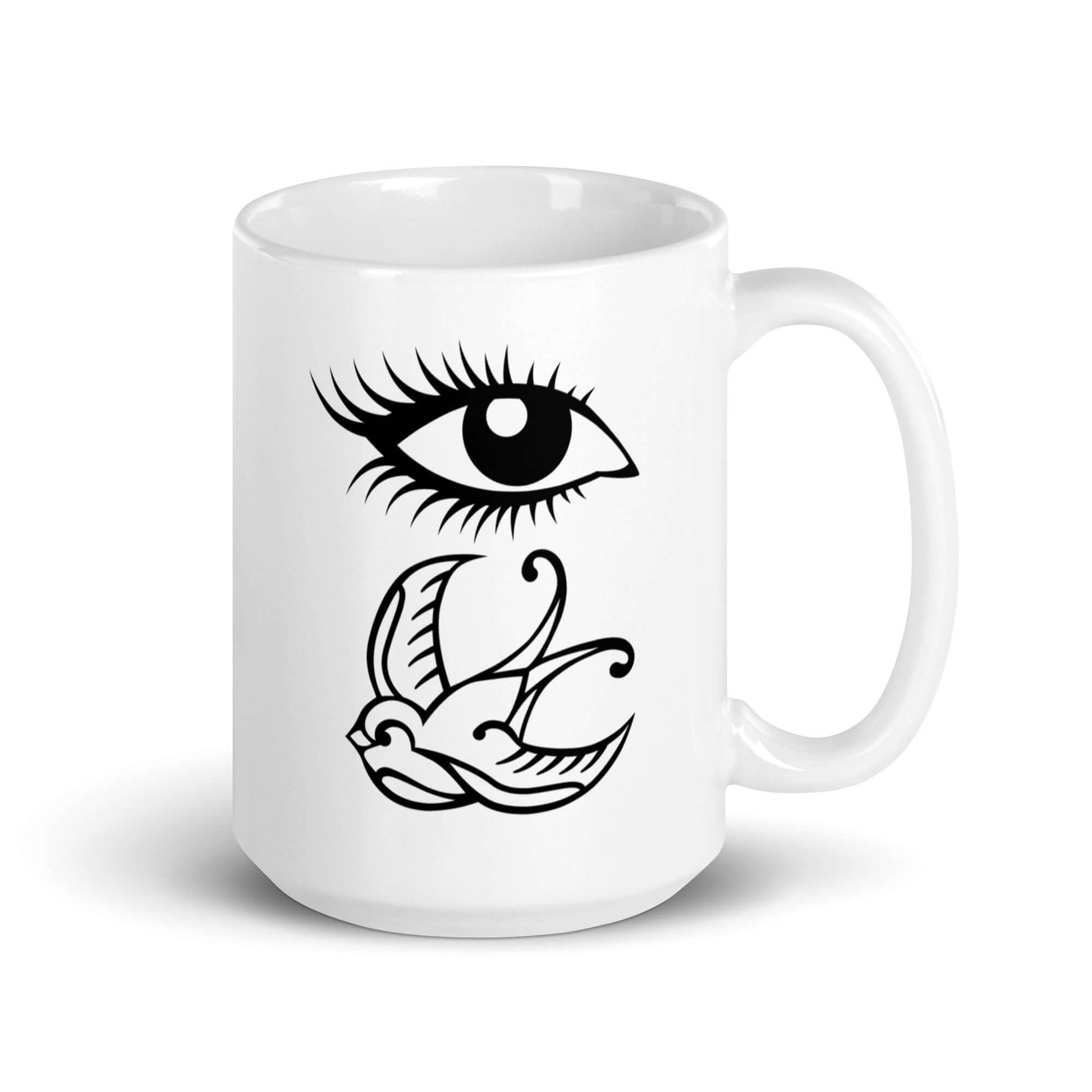 White ceramic mug with outline drawing of an eye and a swallow bird printed on both sides.