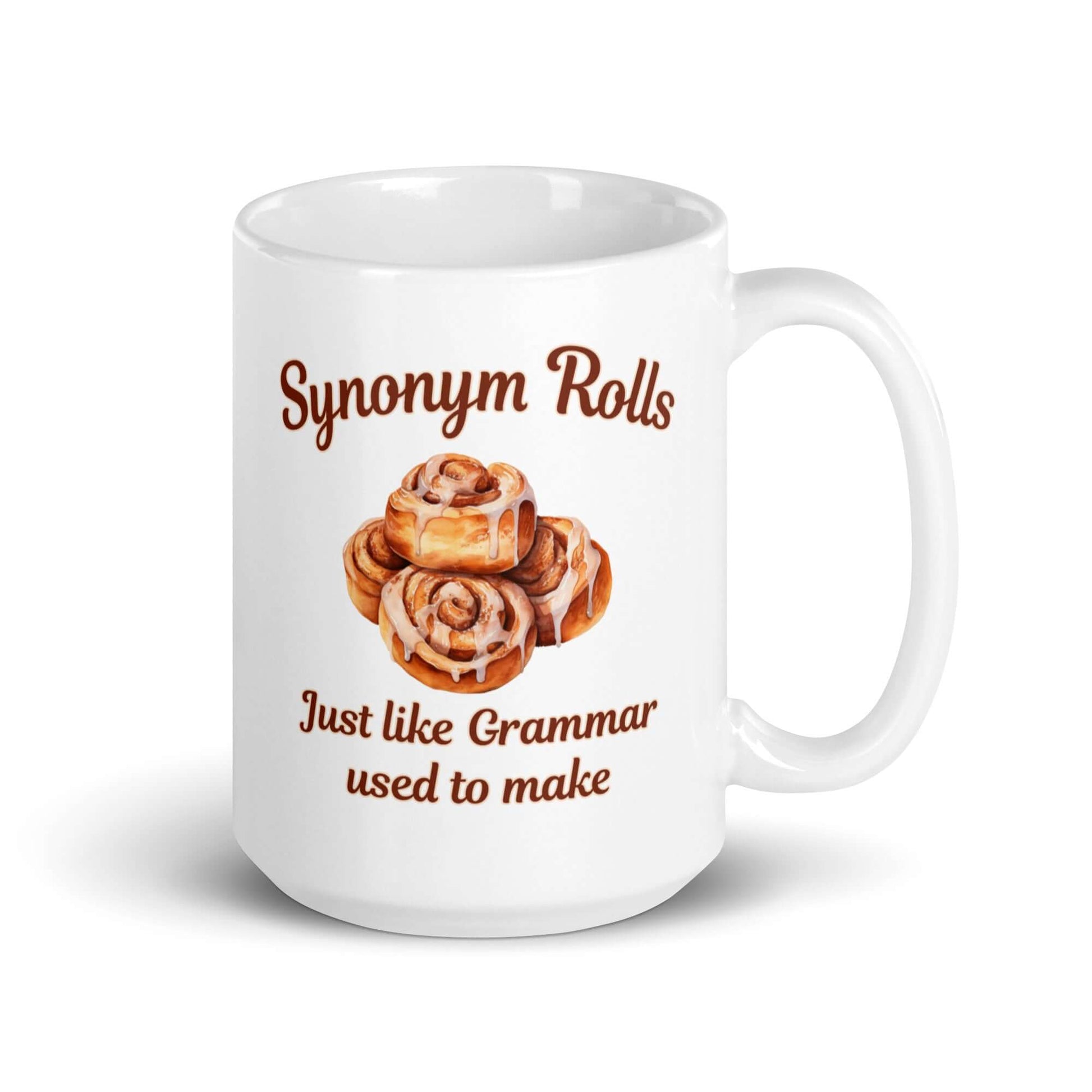 White ceramic coffee mug with an image of cinnamon rolls and the pun phrase Synonym rolls Just like Grammar used to make printed on both sides.