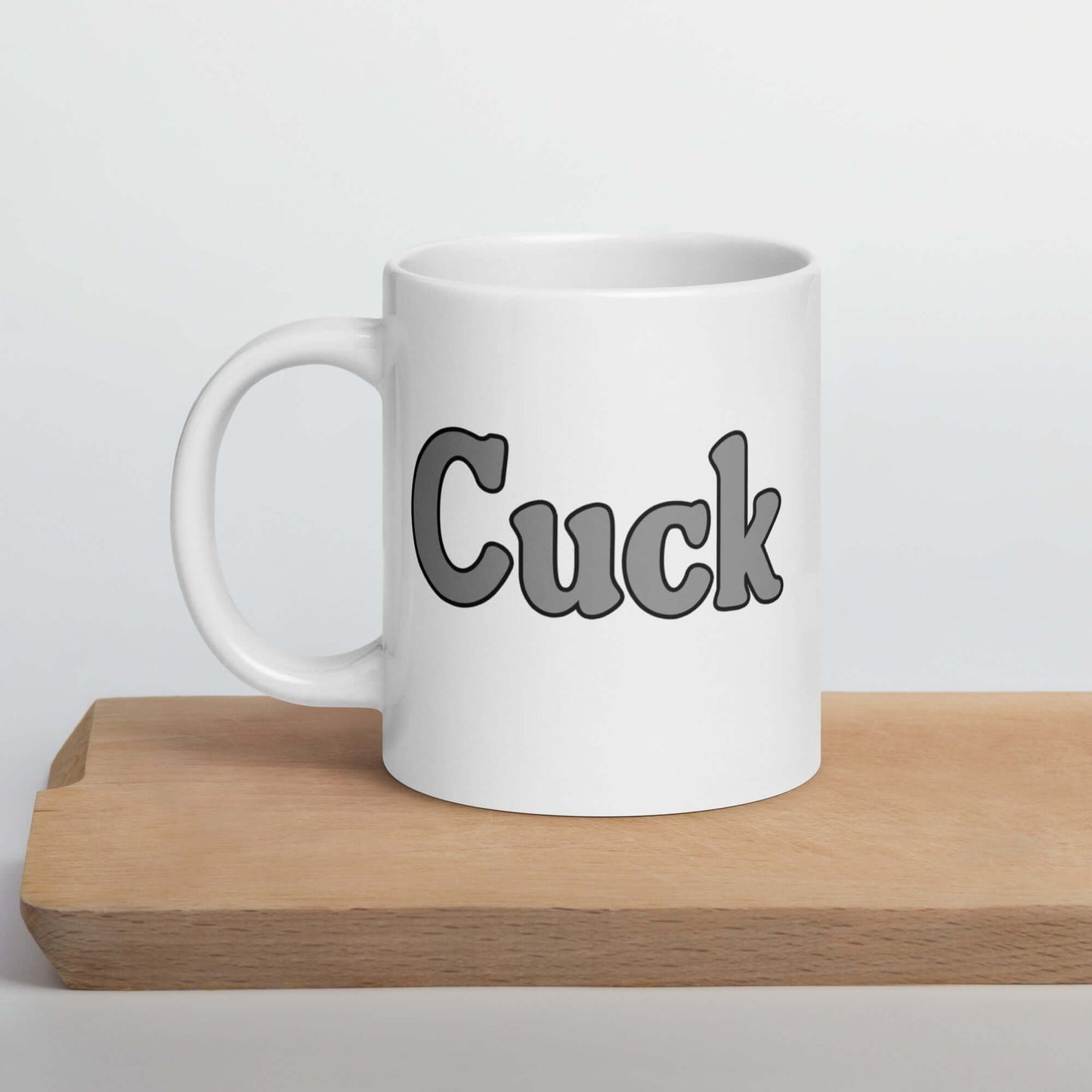 Ceramic coffee mug with the word Cuck printed on both sides.