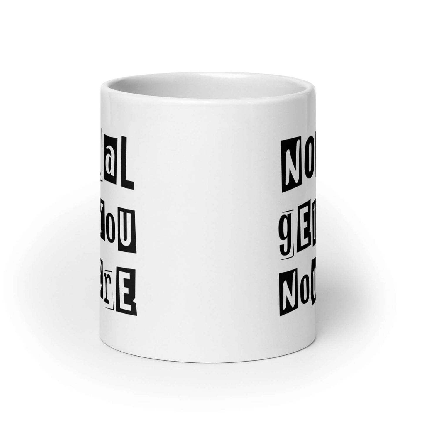 20 ounce white ceramic coffee mug with the phrase Normal gets you nowhere printed on both sides.