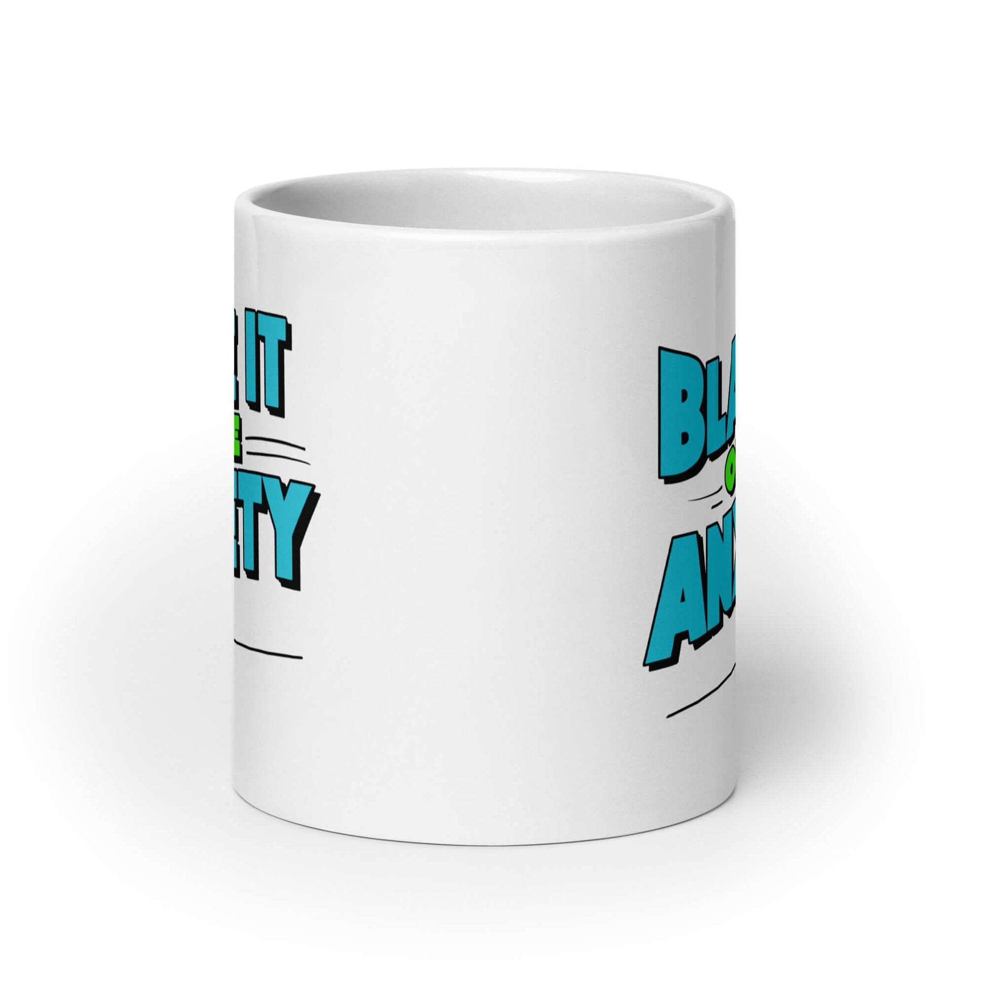 White ceramic mug with the phrase Blame is on the anxiety printed on both sides. The graphics are bold and in aqua and lime green.