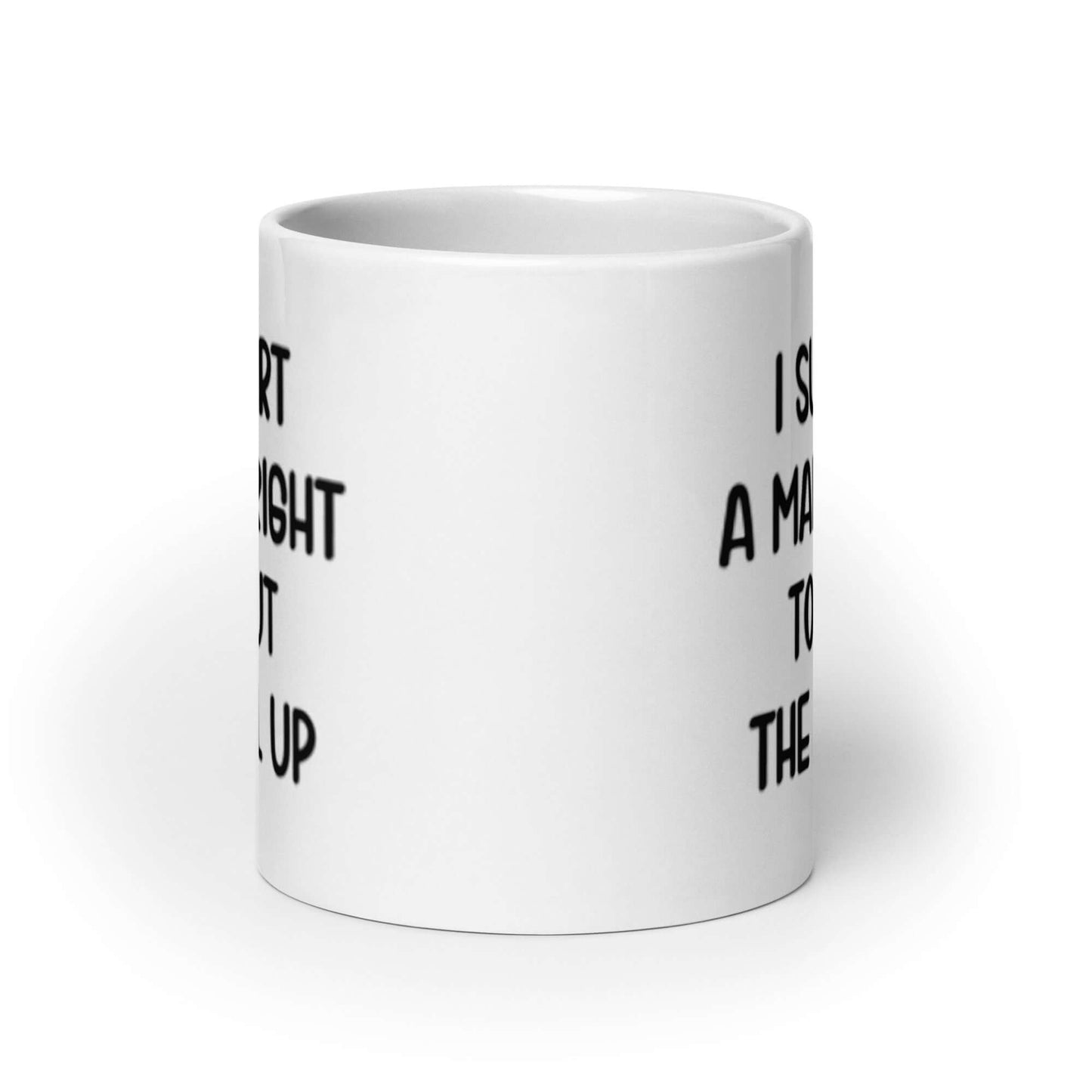 White ceramic mug with the phrase "I support a man's right to shut the hell up" printed on both sides.