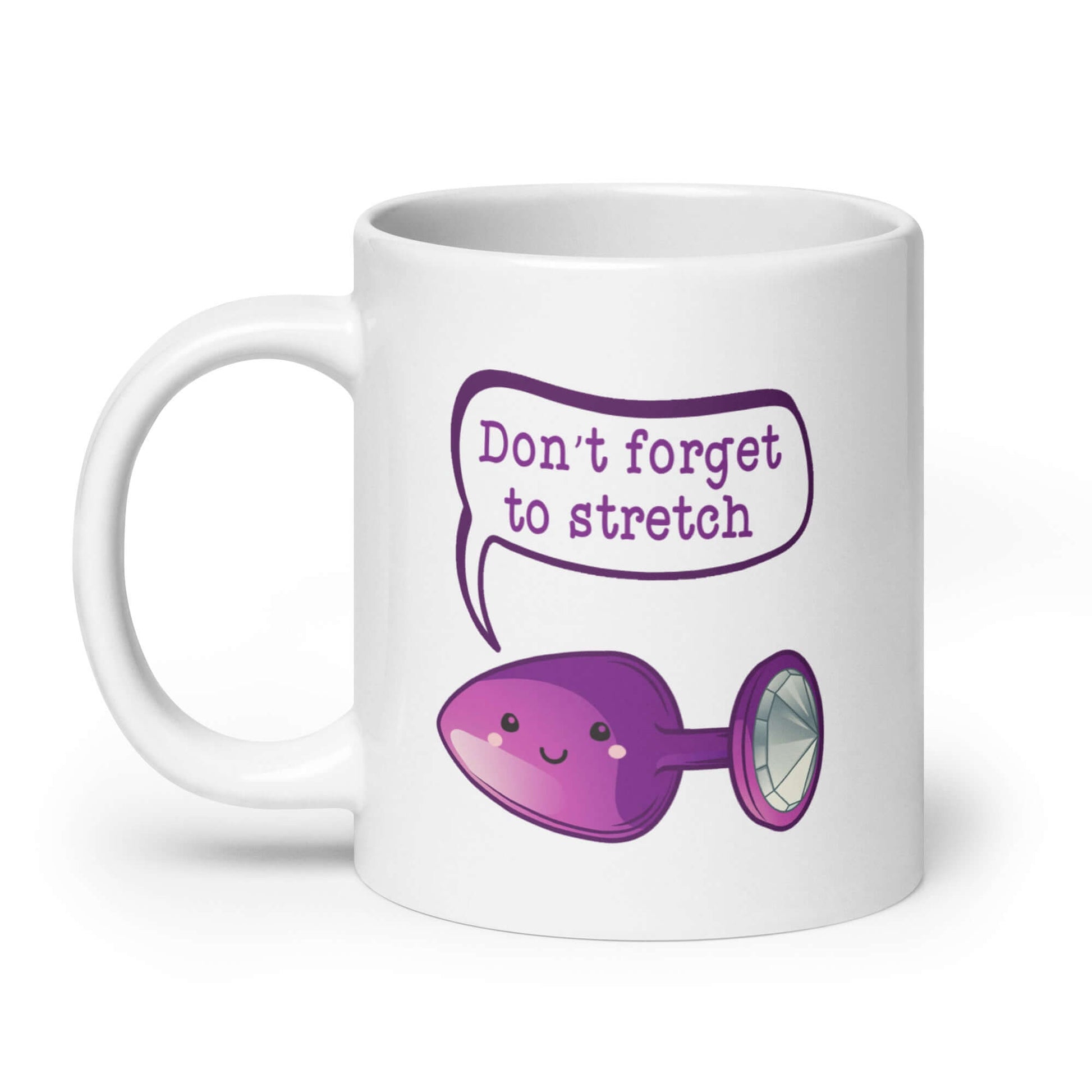 White ceramic mug that has image of a purple anal plug with a smile face with a speech bubble above with the words Don't forget to stretch. The graphics are printed on both sides of the mug.