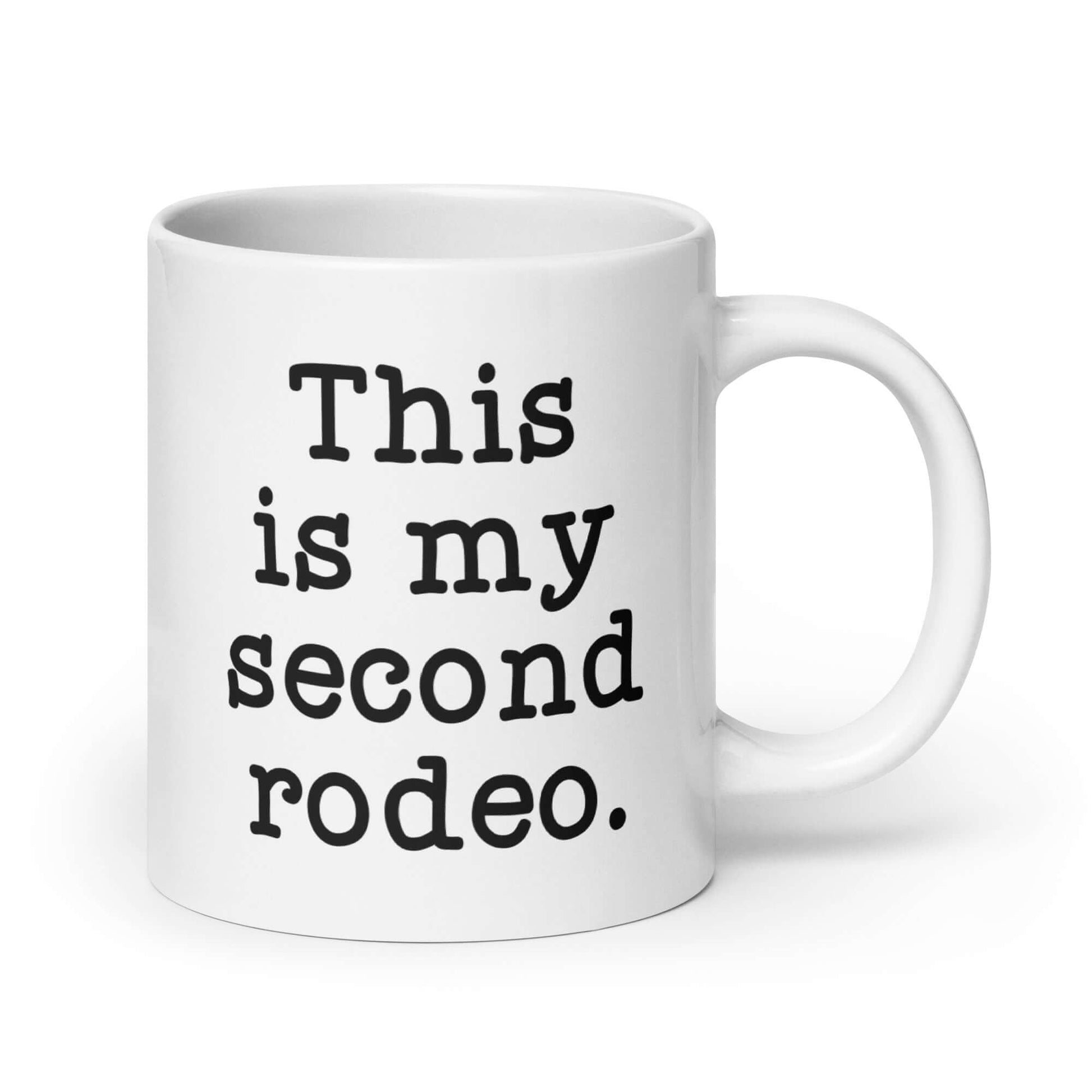 White ceramic mug with the funny phrase This is my second rodeo printed on both sides of the mug.