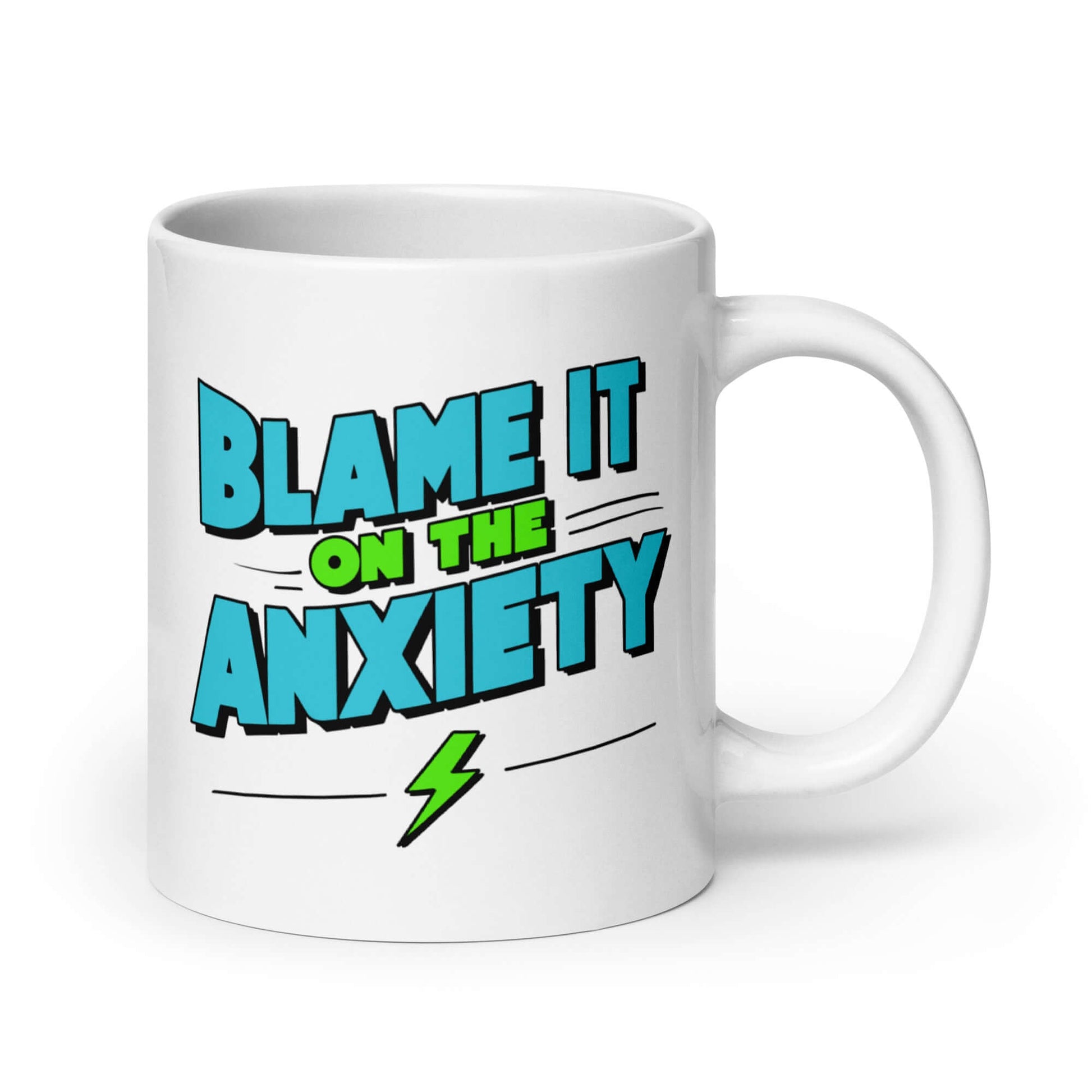 White ceramic mug with the phrase Blame is on the anxiety printed on both sides. The graphics are bold and in aqua and lime green.