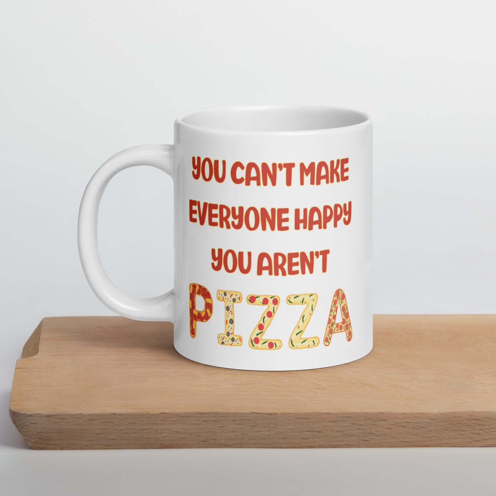 White ceramic coffee mug with the phrase You can't make everyone happy, you aren't pizza printed on both sides.