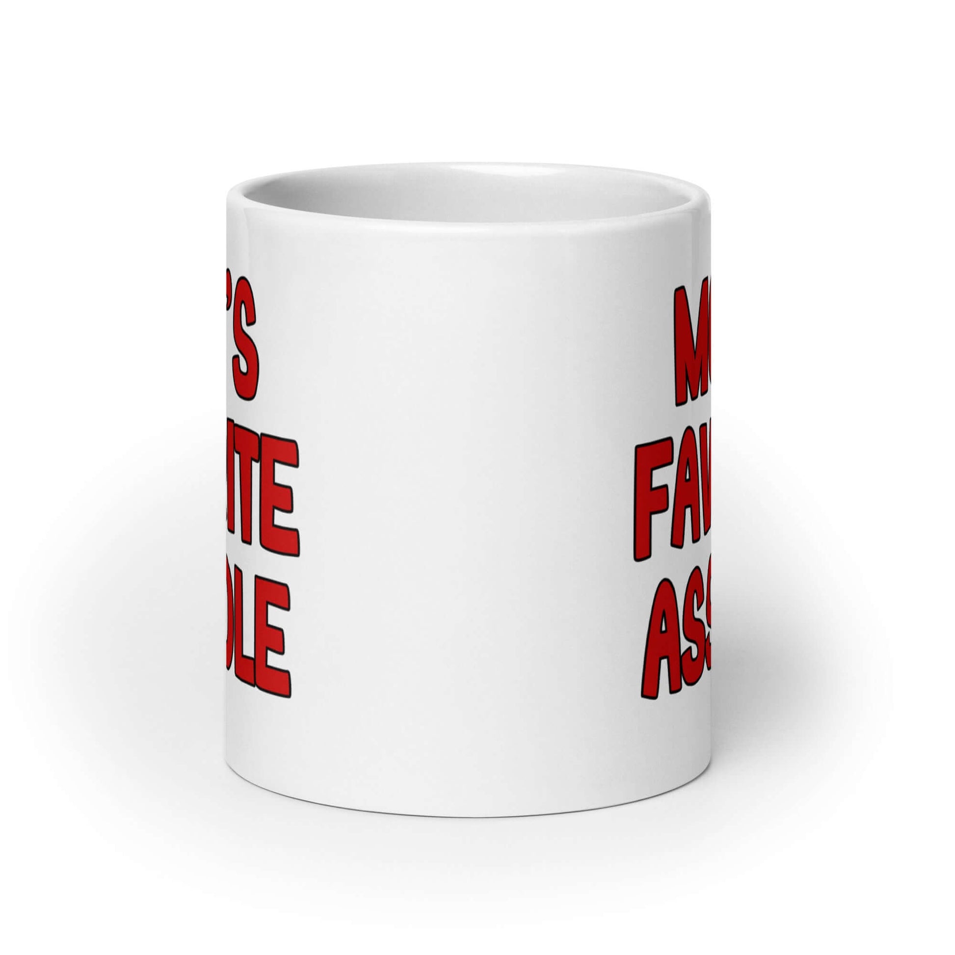 White ceramic mug with the words Mom's favorite asshole printed in red on both sides of the mug.