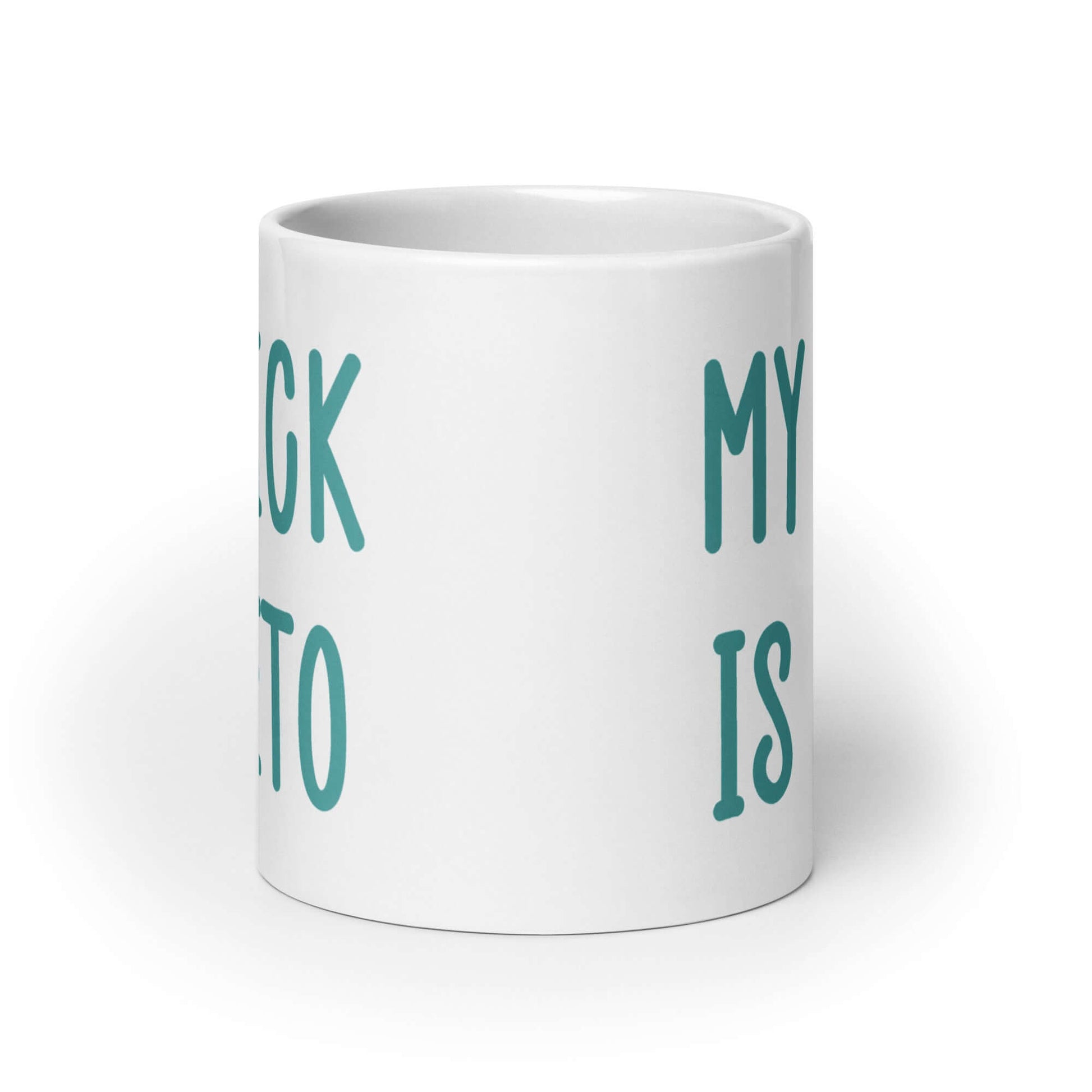 White ceramic coffee mug with the phrase My dick is keto printed on both sides in turquoise font.