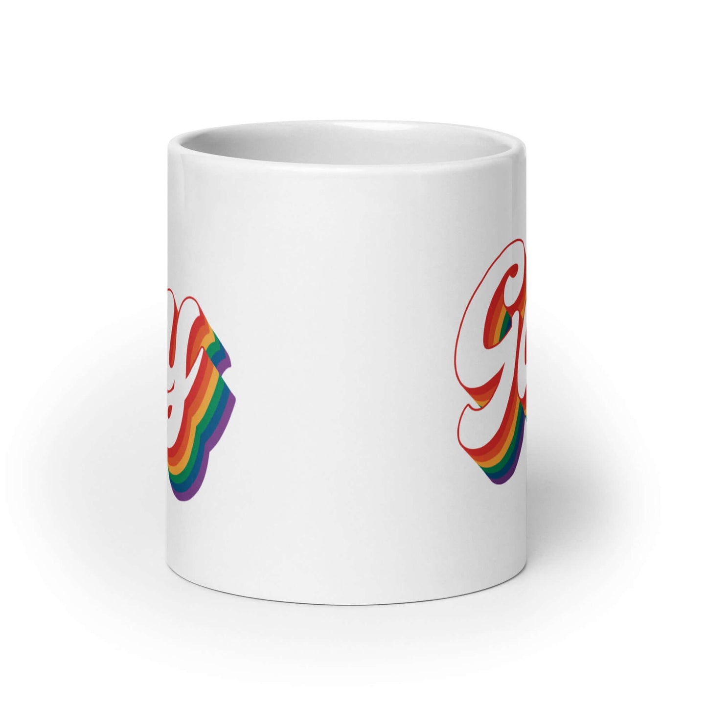 White ceramic mug with the word Gay printed on both sides. The word gay is outlined in rainbow.