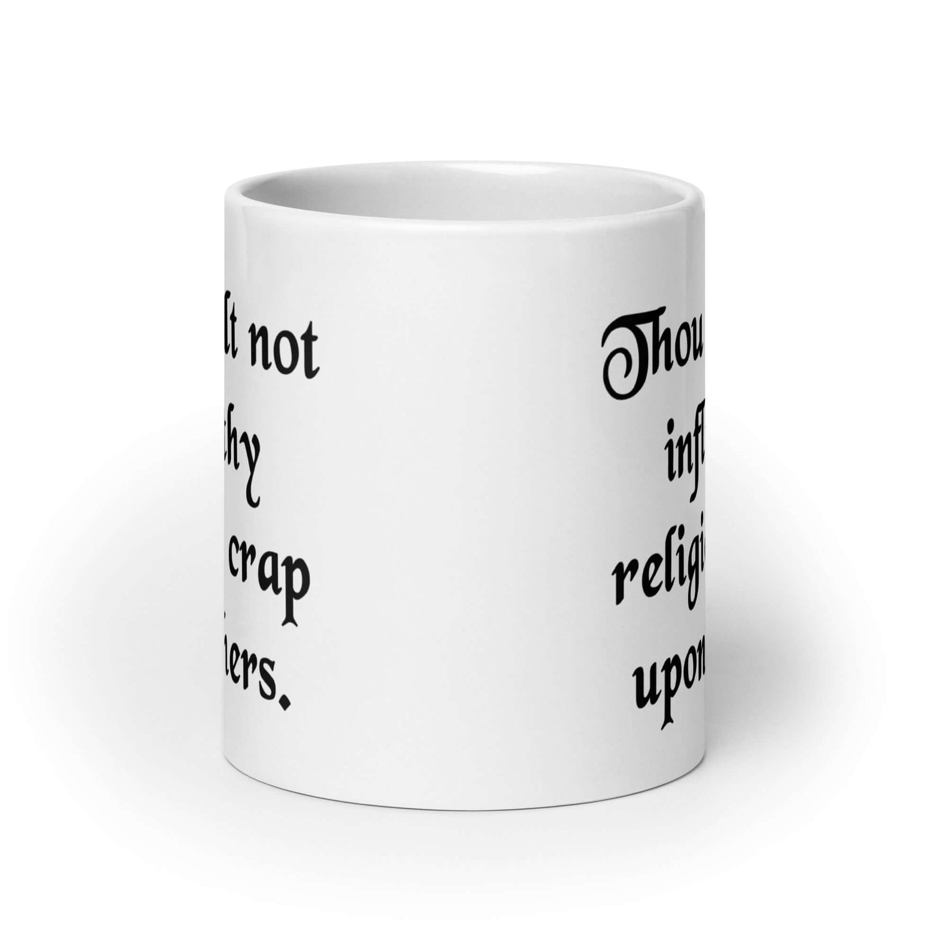 White ceramic coffee mug with the phrase Thou shalt not inflict thy religious crap upon others printed on both sides.