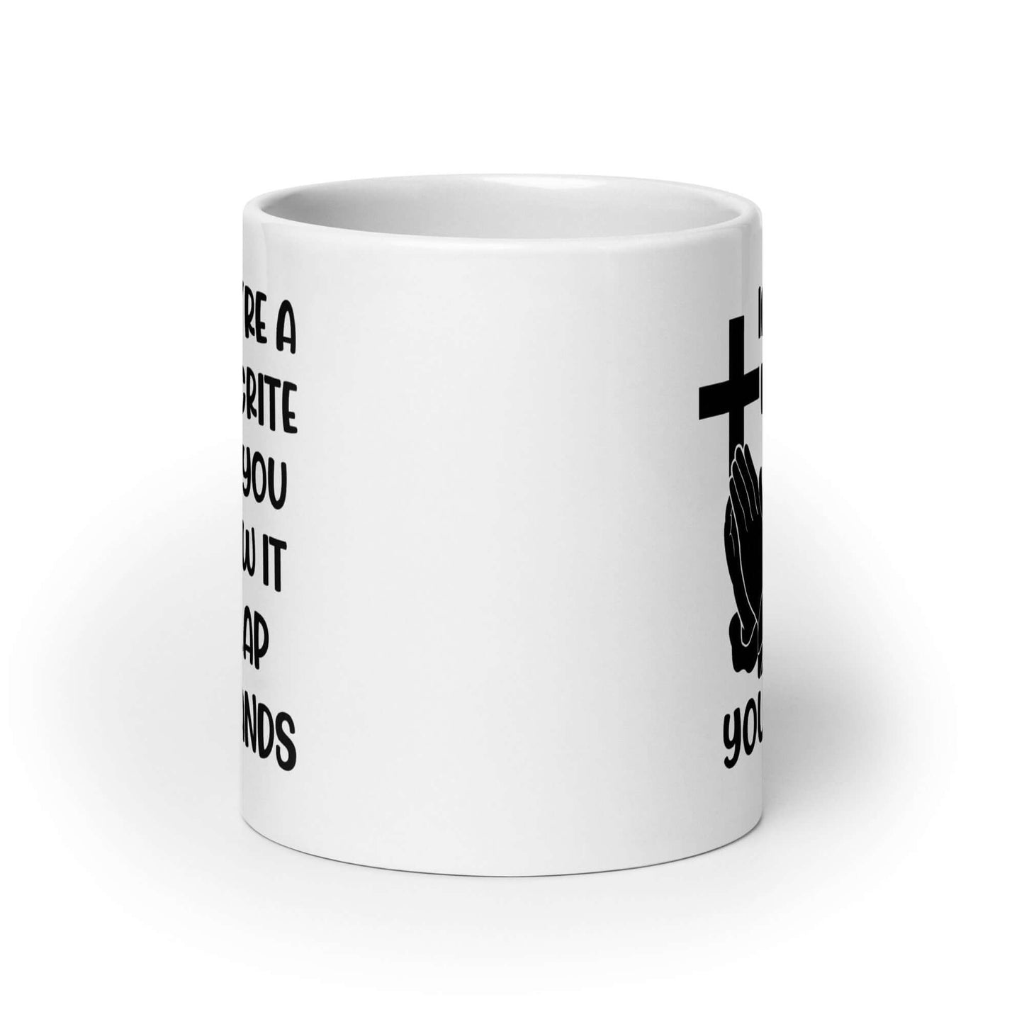 White ceramic mug with image of a cross and praying hands & the words If you're a hypocrite and you know it clap your hands printed on both sides.