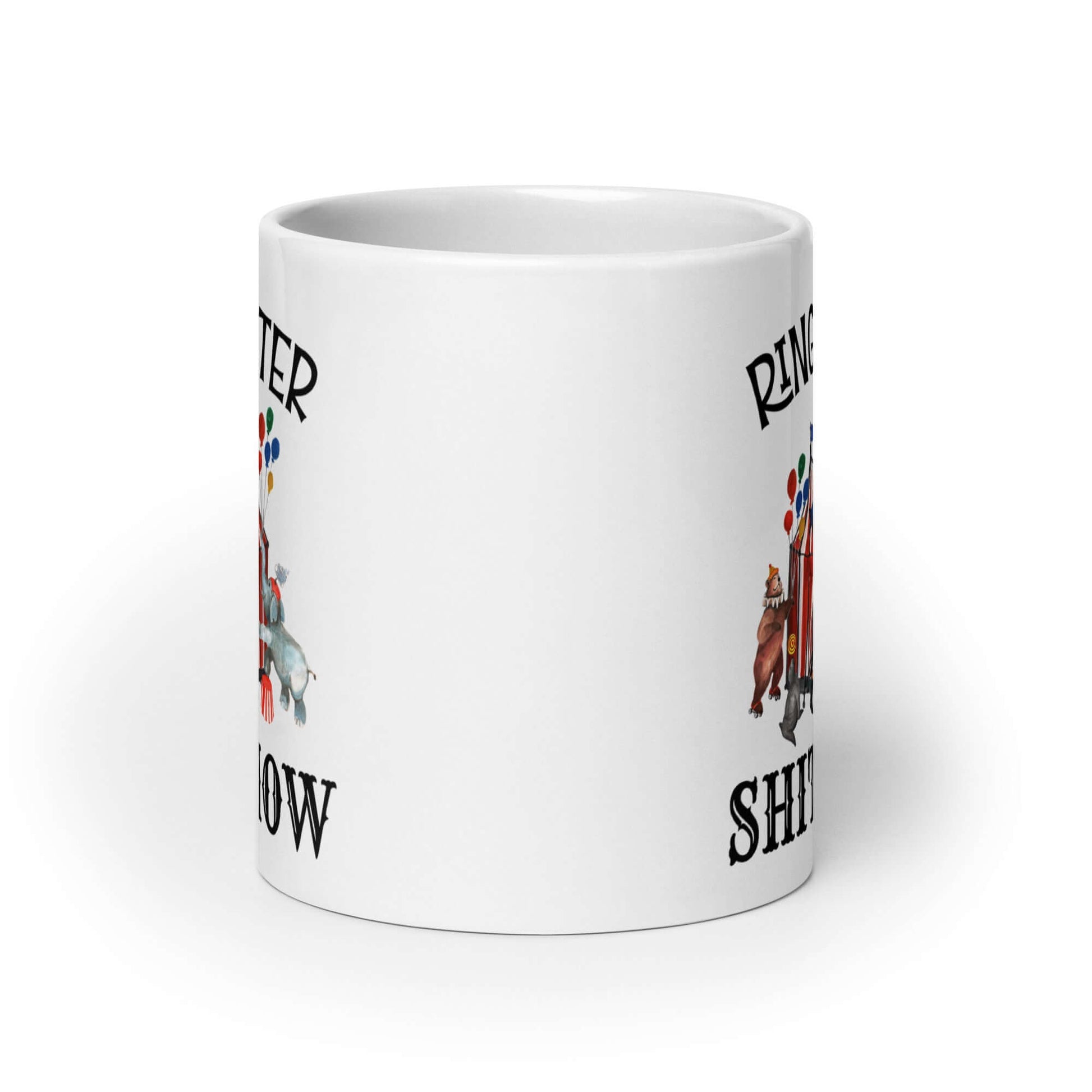 White ceramic coffee mug with a circus theme graphic and the words Ringmaster of the Shitshow printed on both sides.