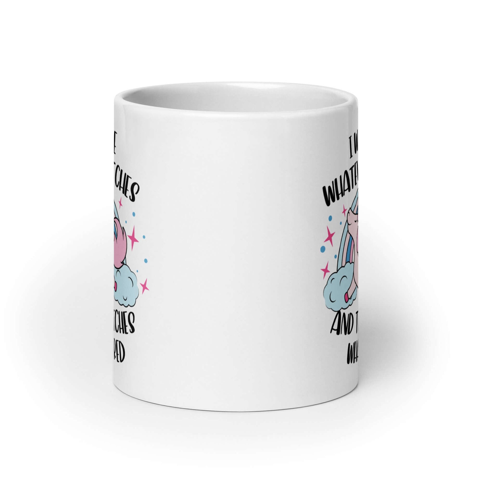 White ceramic coffee mug with a prancing unicorn rainbow graphic. The phrase I was like whatever bitches and the bitches whatevered printed on both sides.