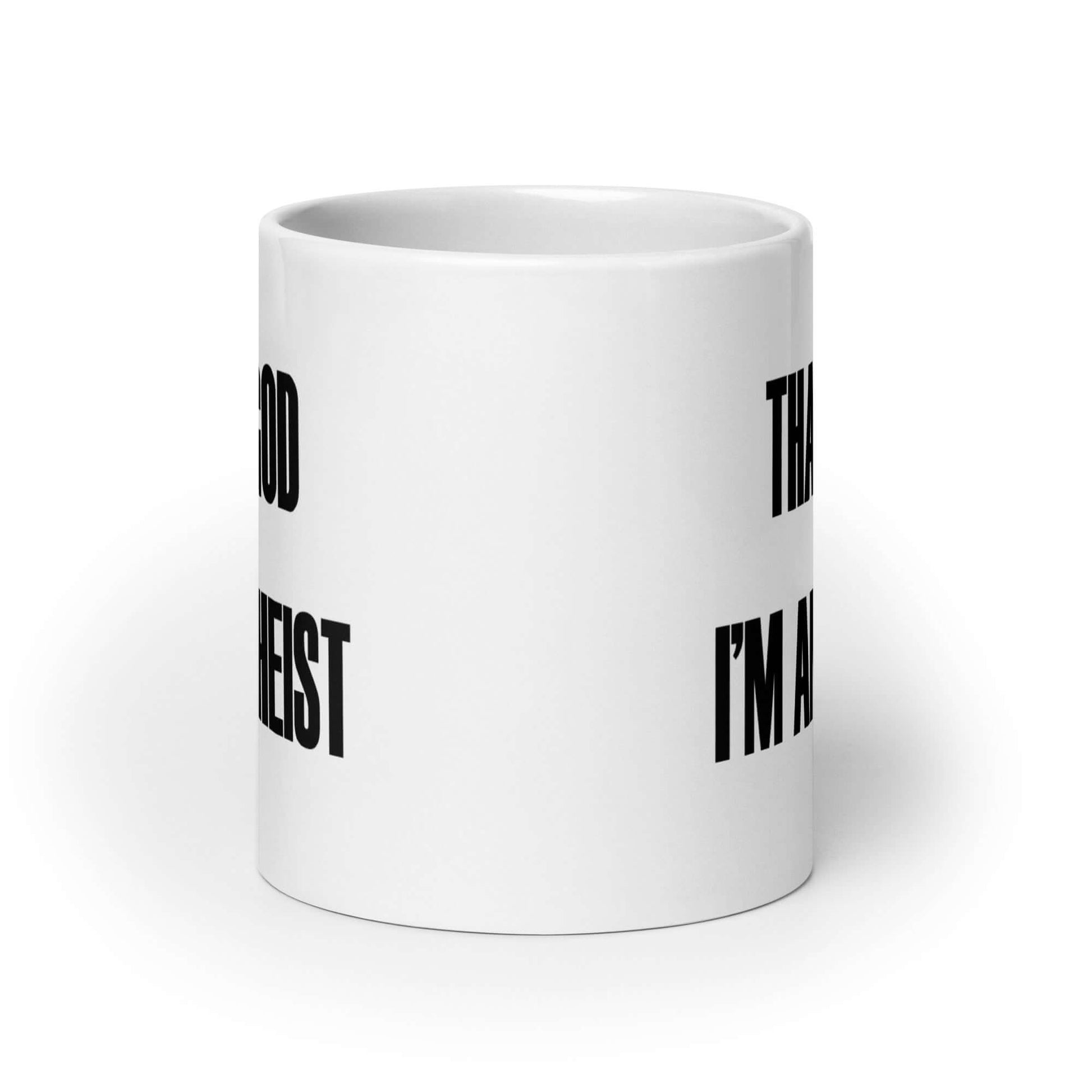 White ceramic mug with the words Thank God I'm an atheist printed on both sides.