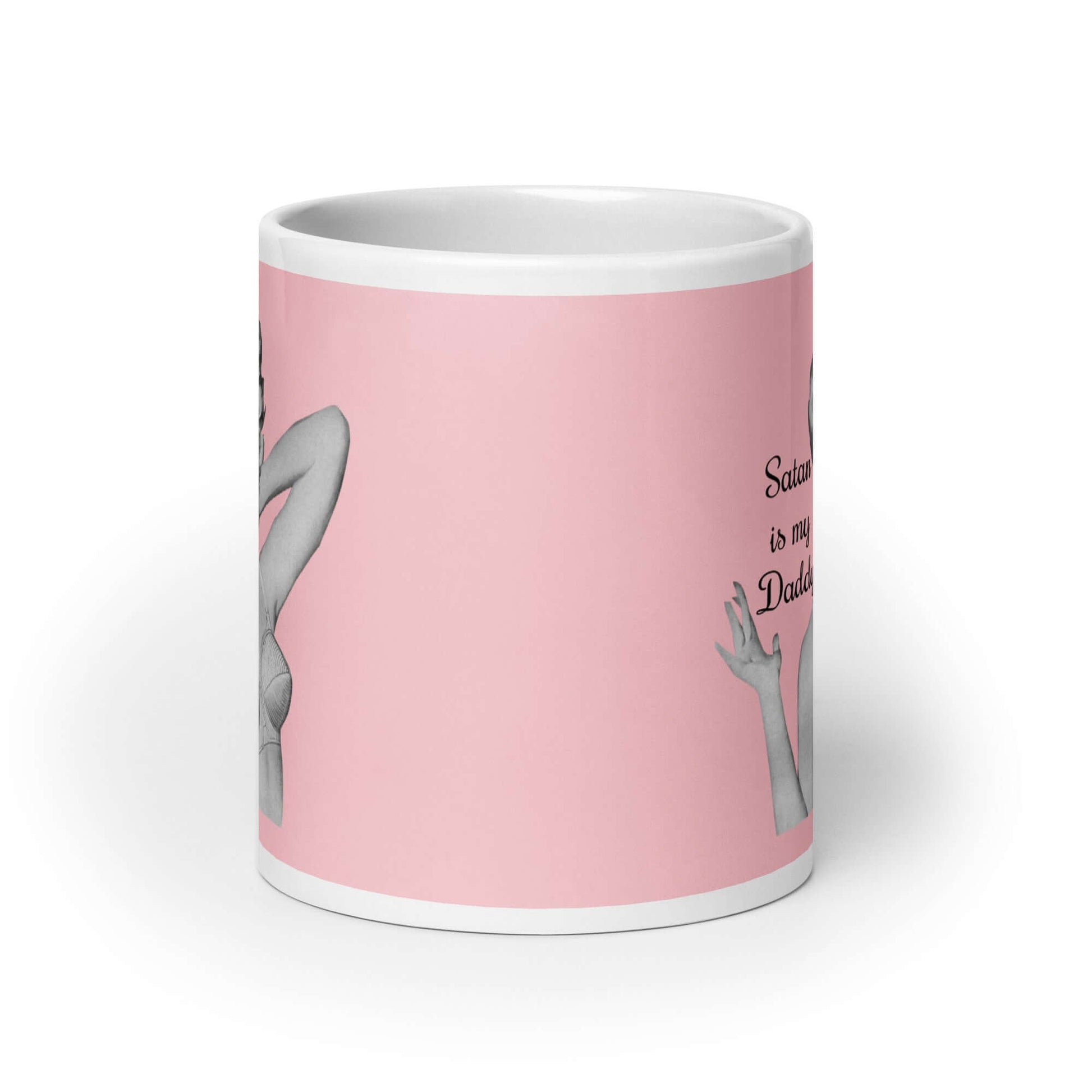 Pink and white ceramic coffee mug with an image of a retro black & white pin-up model and the phrase Satan is my Daddy printed on both sides.