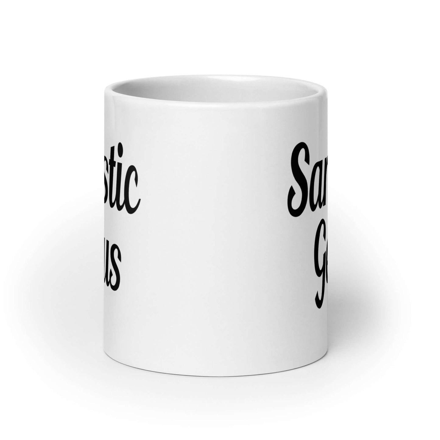 White ceramic coffee mug with the words Sarcastic Genius printed on both sides of the mug.
