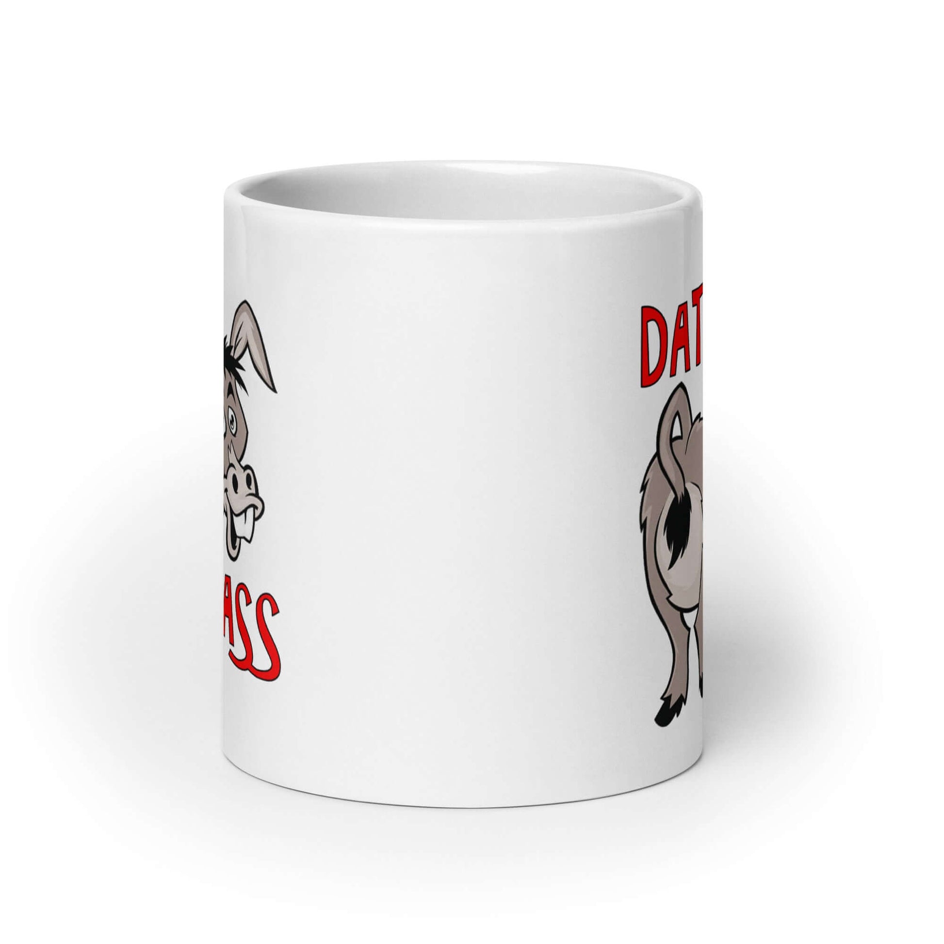 White ceramic coffee mug with an image of a goofy donkey and the words Dat Ass printed on both sided of the mug.