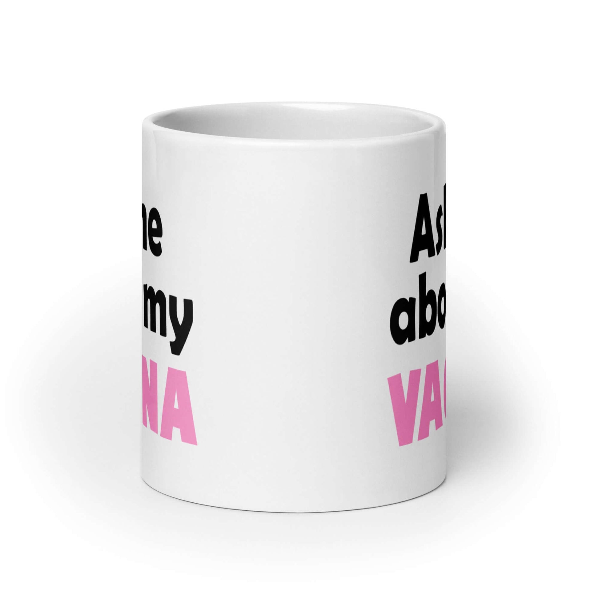 White ceramic mug with the words Ask me about my vagina printed on both sides. The word vagina is printed in pink. The rest of the text is black.
