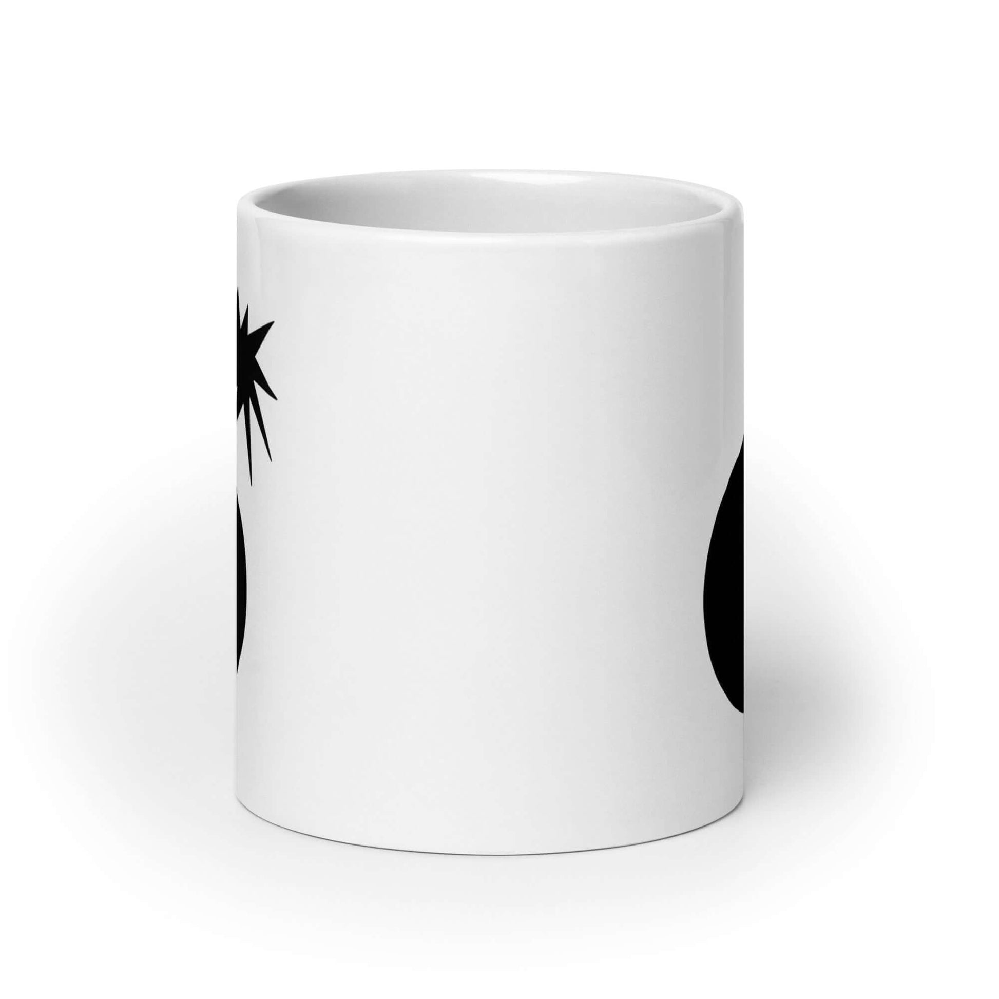 White ceramic coffee mug with an image of a bomb & the letter F printed in the center. The graphics are printed on both sides of the mug.