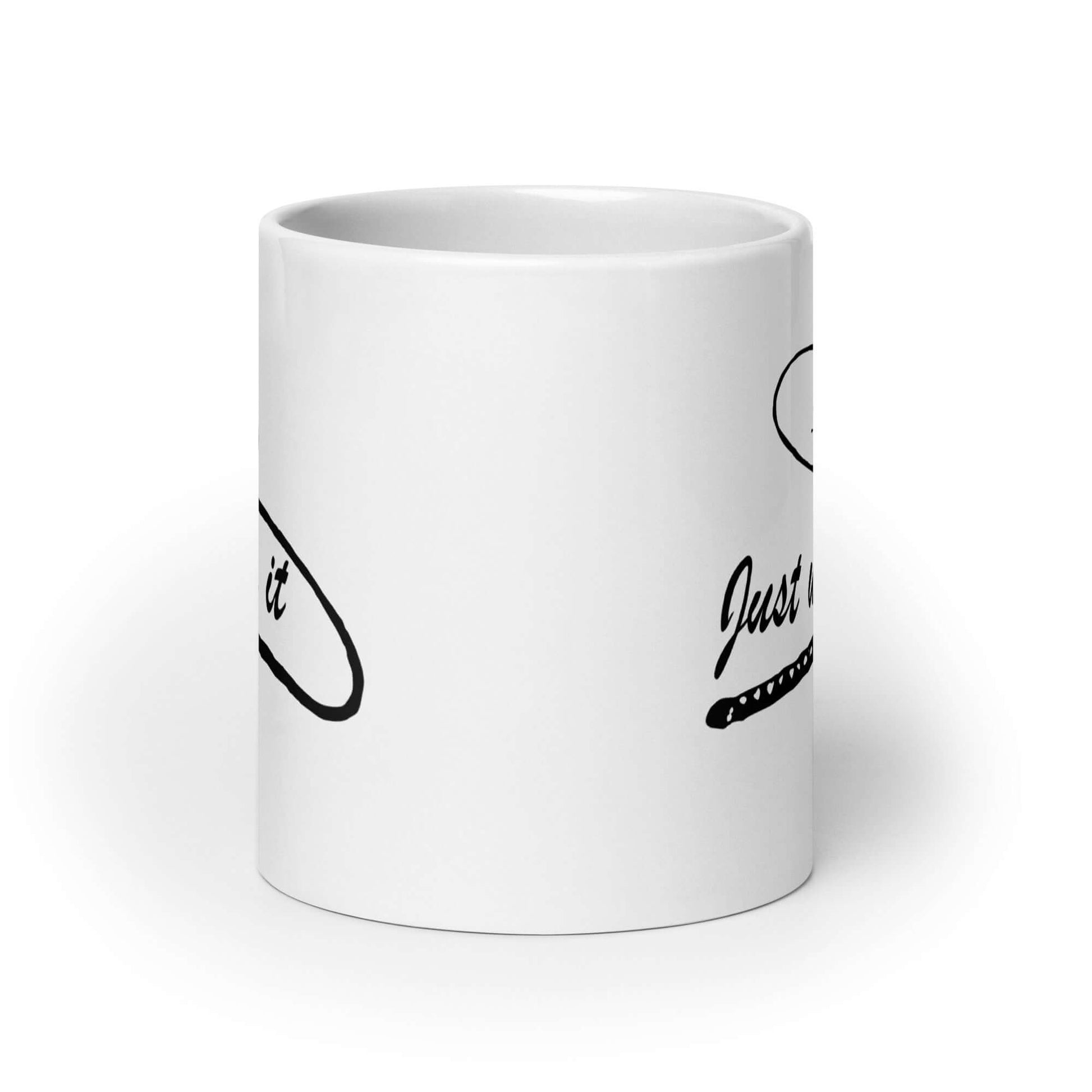 White ceramic coffee mug with a line drawing image of a leather bullwhip and the words Just whip it printed on both sides.